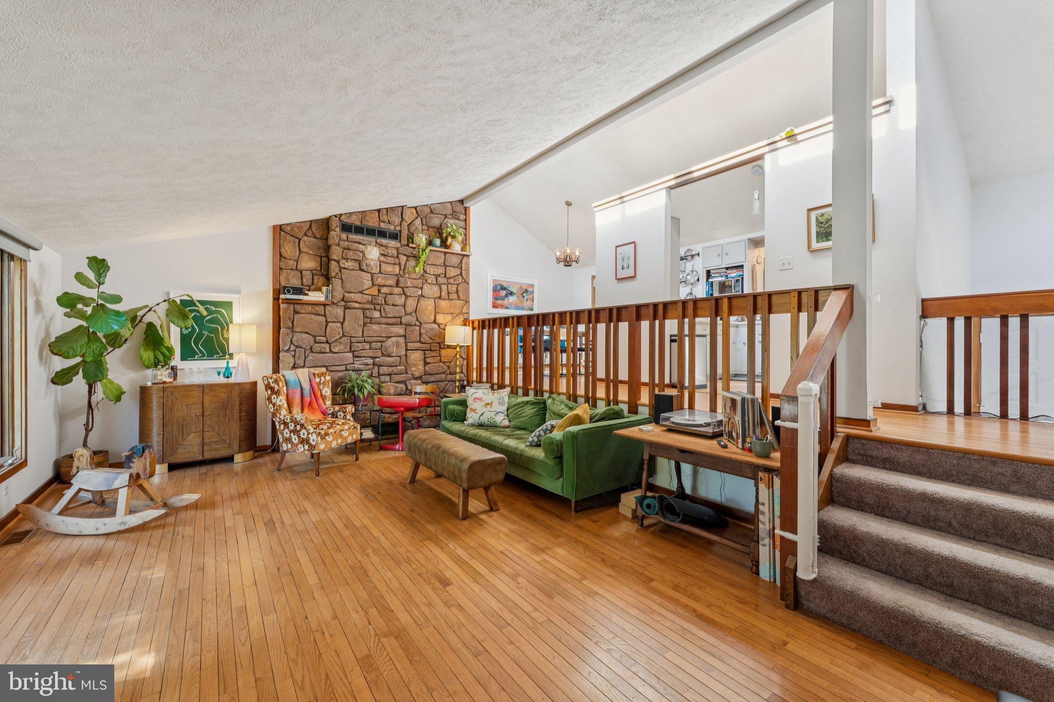 1684 Chain Bridge Road McLean, VA 22101 - Photo 3 of 23 a living room with furniture floor to ceiling window and wooden floor