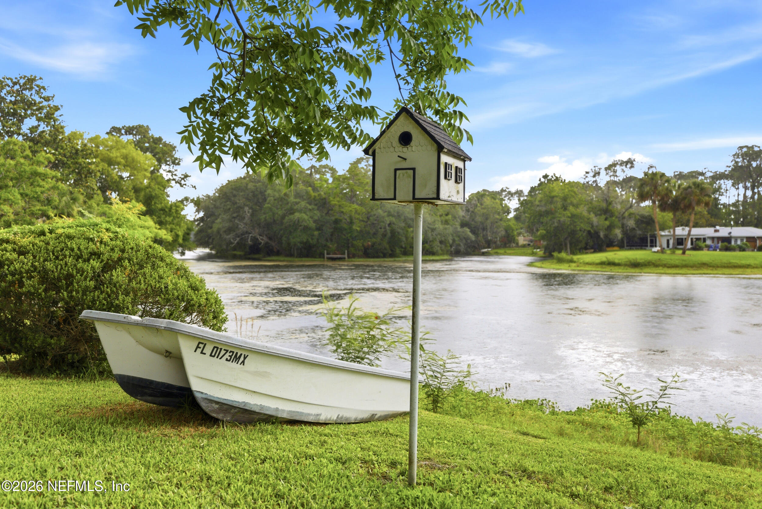 7484 Spinola Road Jacksonville, FL 32217 - Photo 53 of 63 a view of a house with a yard and lake view