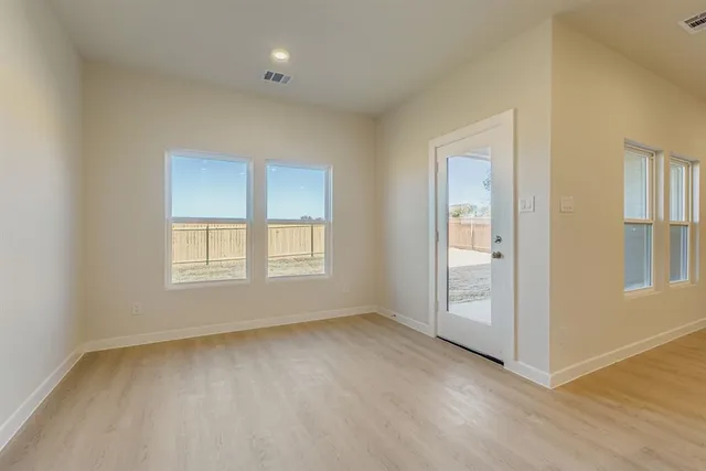 an empty room with windows