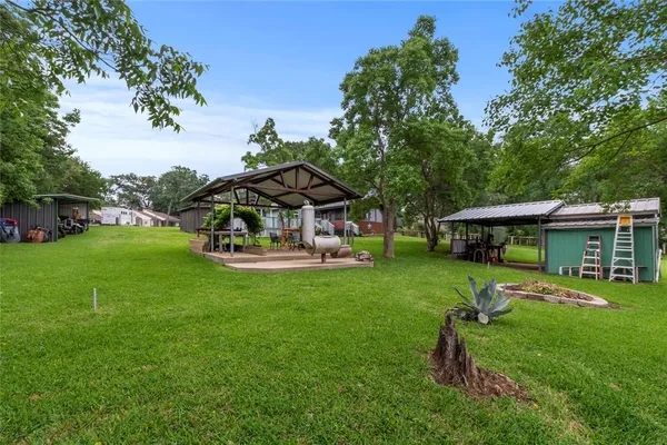 a view of a yard in front of a house with a small yard