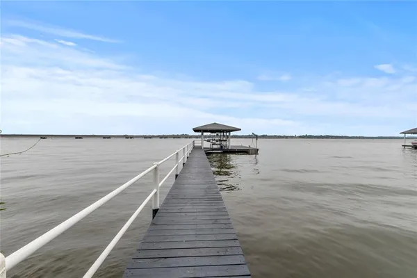 a view of wooden floor with a lake