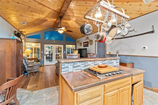 a kitchen with a stove and a table