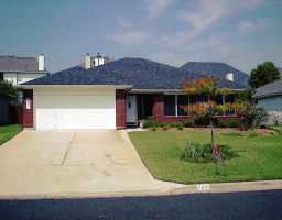 7100 Wandering Oak Road Austin, TX 78749 - Photo 1 of 1 a view of a house with a backyard and a patio