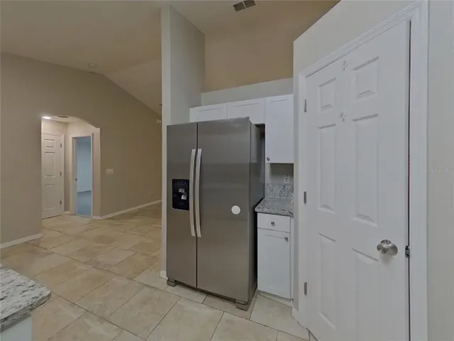 a bathroom with a shower and a glass door