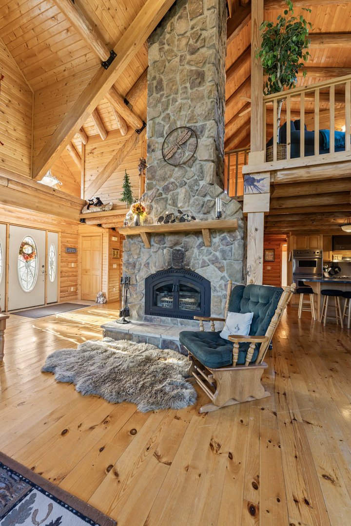 18508 128th Street Bristol, WI 53104 - Photo 11 of 48 a view of a fireplace with a table and chairs