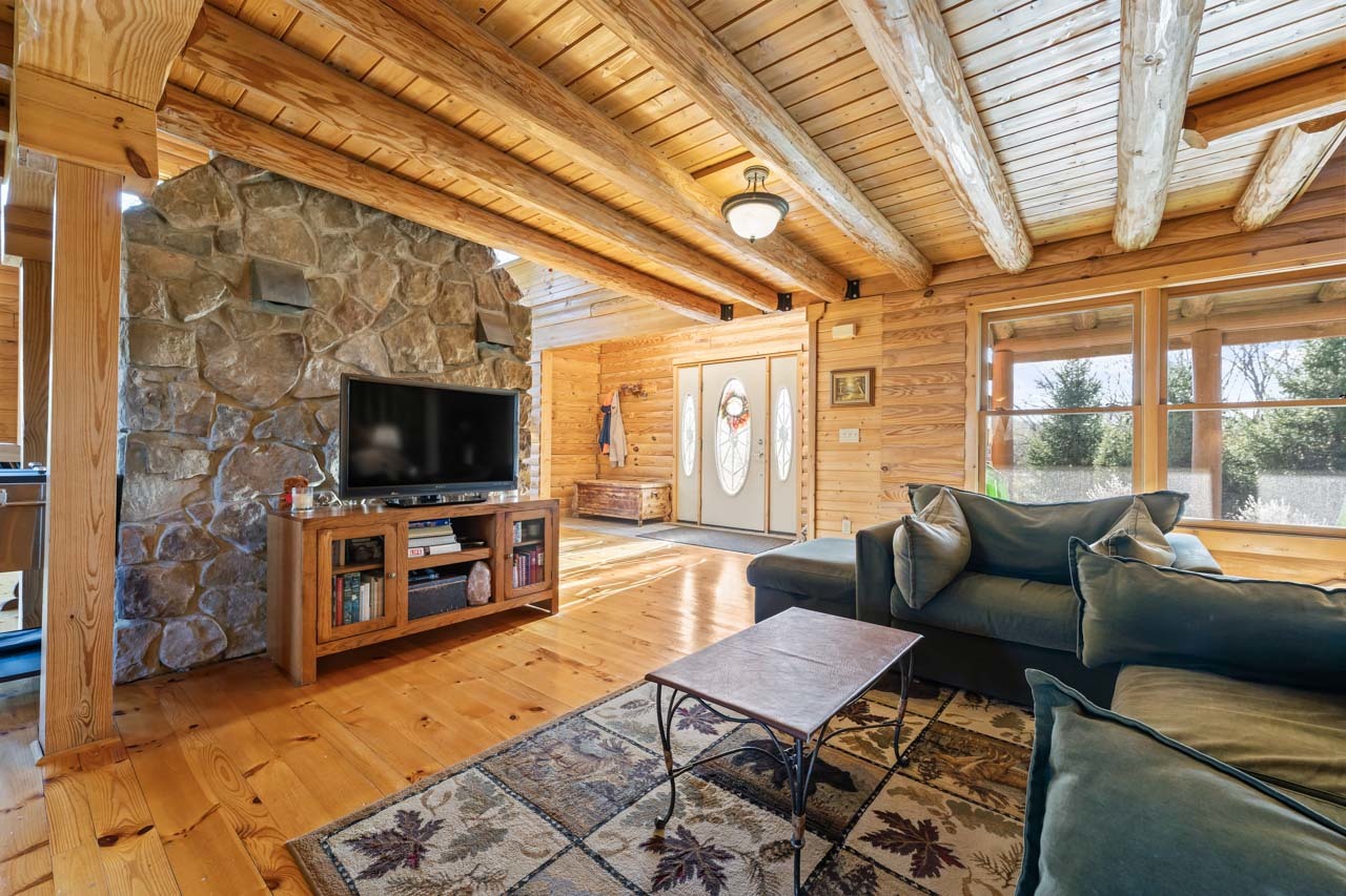 18508 128th Street Bristol, WI 53104 - Photo 17 of 48 a living room with furniture and a flat screen tv