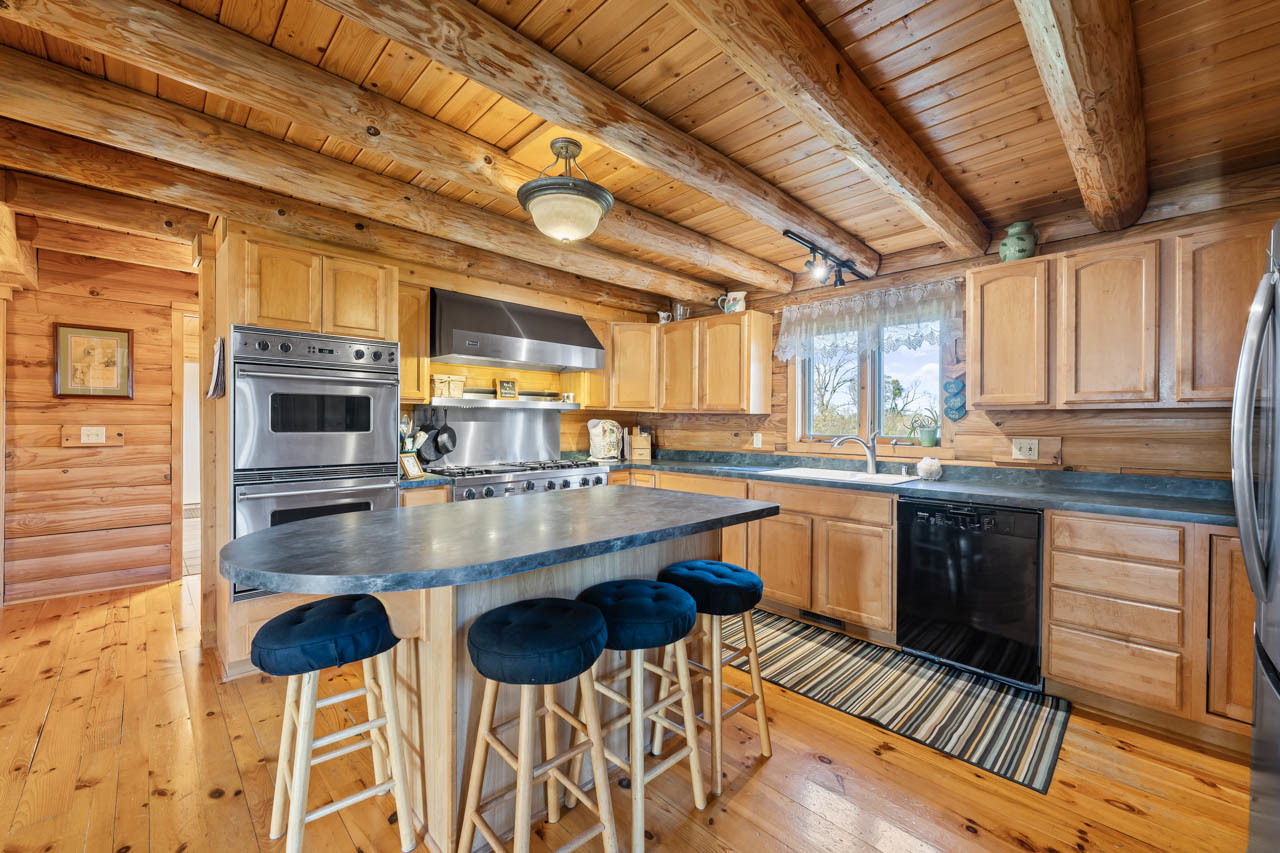 18508 128th Street Bristol, WI 53104 - Photo 19 of 48 a kitchen with stainless steel appliances a sink and cabinets