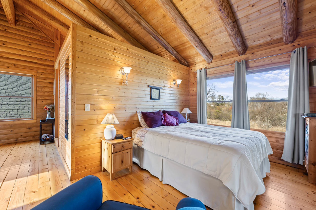 18508 128th Street Bristol, WI 53104 - Photo 28 of 48 a bedroom with a bed and wooden floor