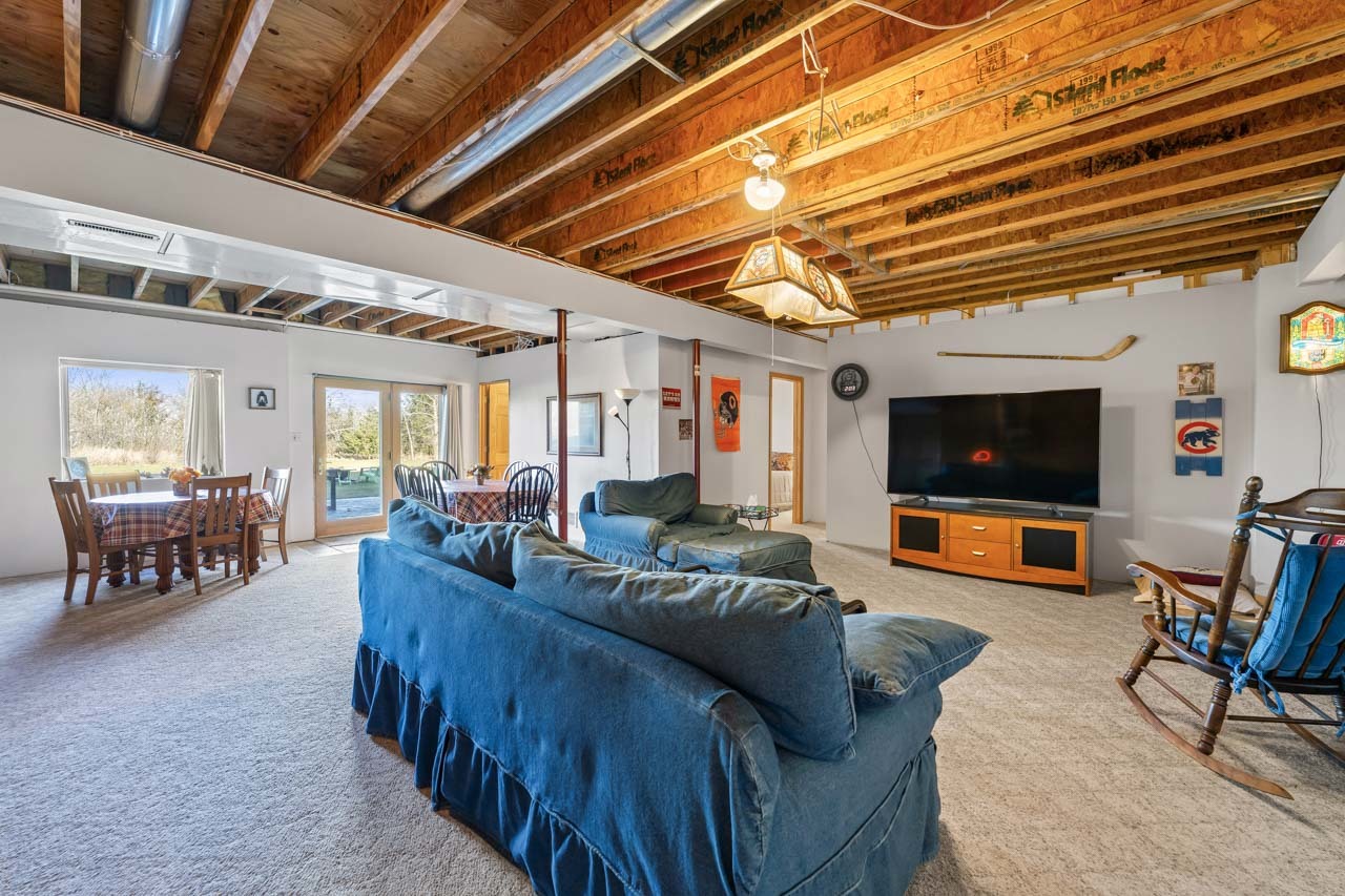 18508 128th Street Bristol, WI 53104 - Photo 30 of 48 a living room with furniture and a flat screen tv