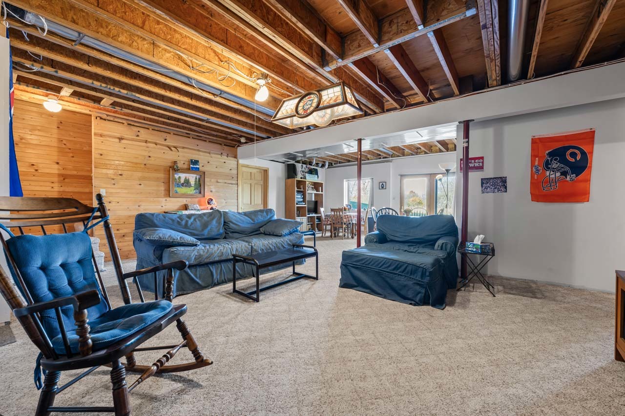 18508 128th Street Bristol, WI 53104 - Photo 33 of 48 a living room with furniture and a flat screen tv