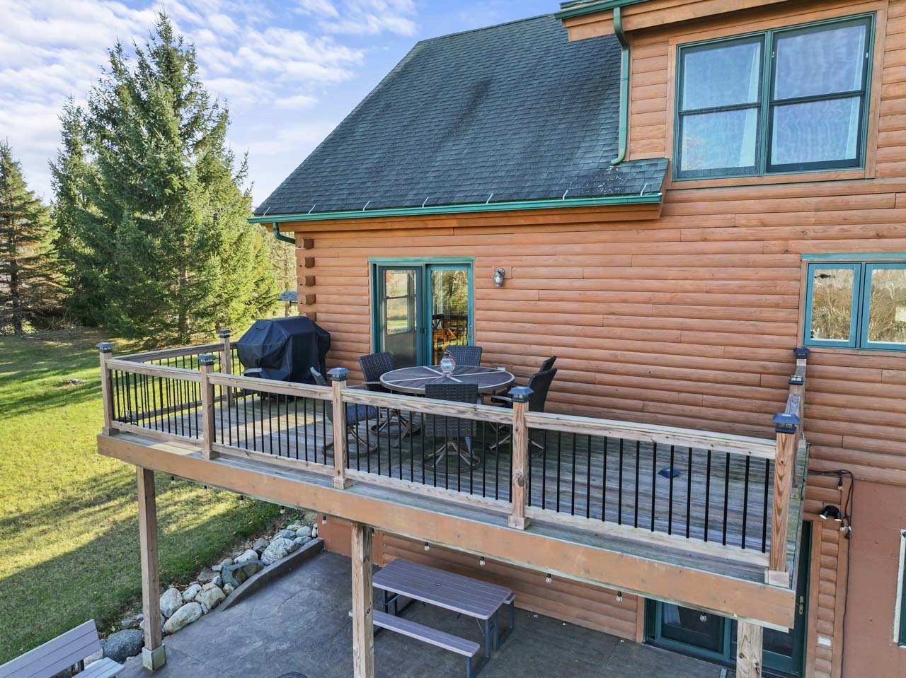18508 128th Street Bristol, WI 53104 - Photo 43 of 48 a view of a chair and table on the deck