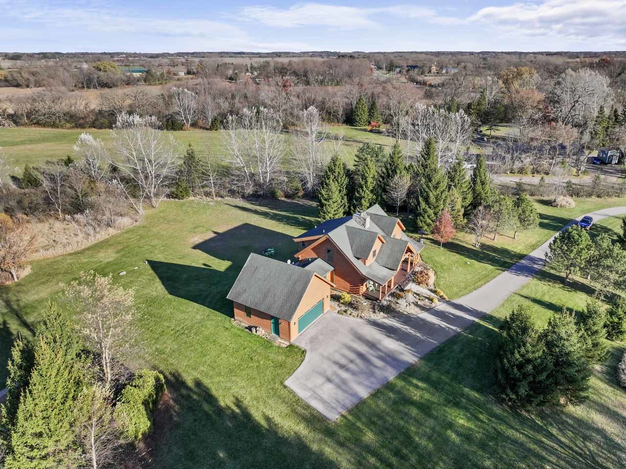 18508 128th Street Bristol, WI 53104 - Photo 46 of 48 an aerial view of a house with a garden and lake view