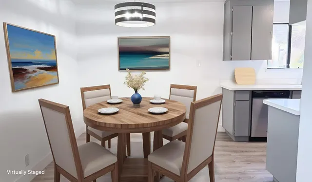 a dining room with furniture and wooden floor