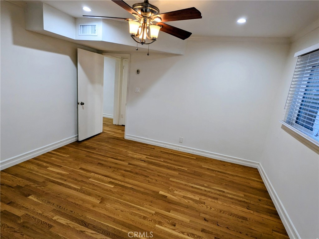 1019 6th Street, Unit 2 Santa Monica, CA 90403 - Photo 9 of 15 wooden floor in an empty room with a chandelier
