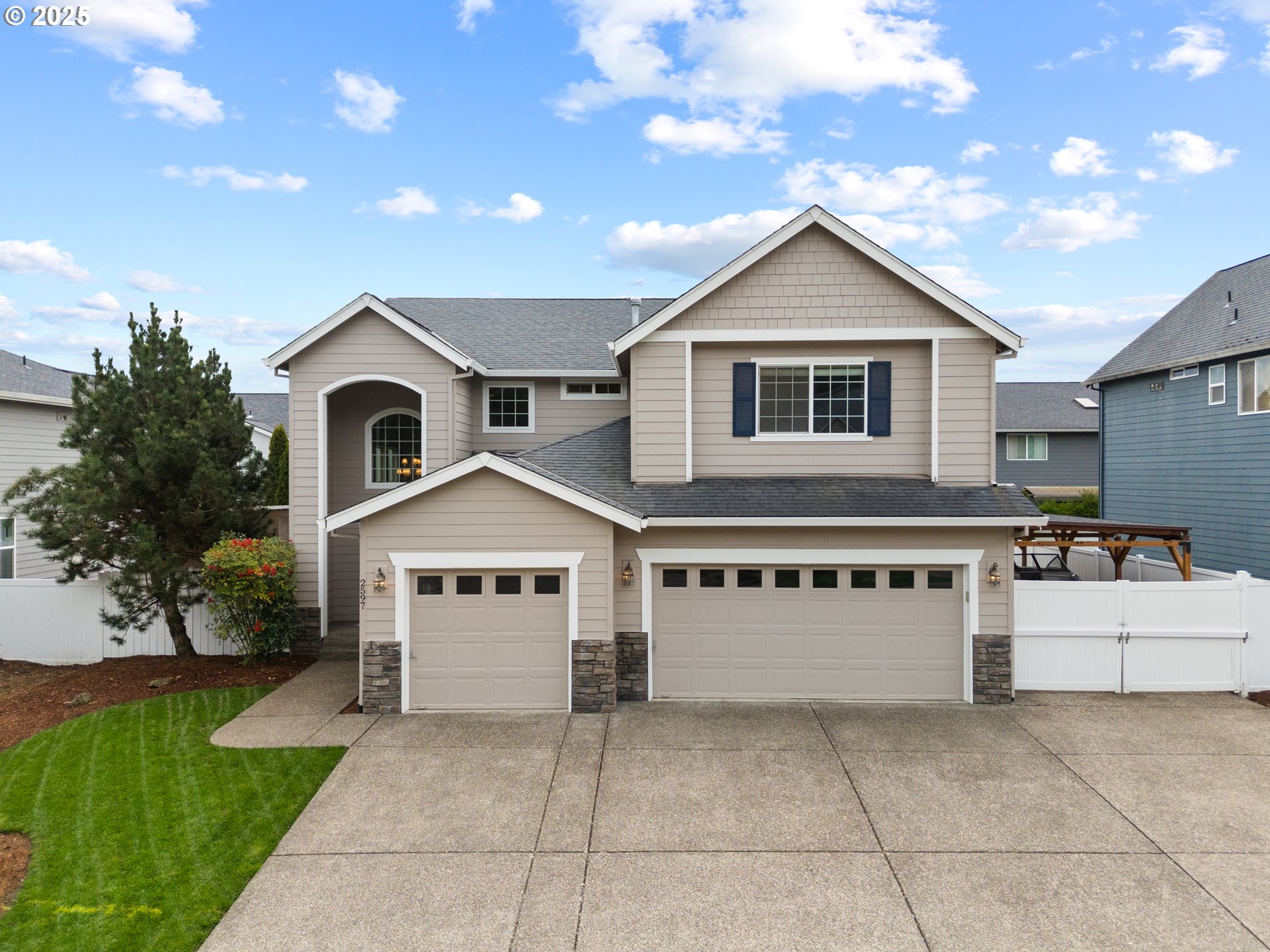 a view of house with yard in front of it