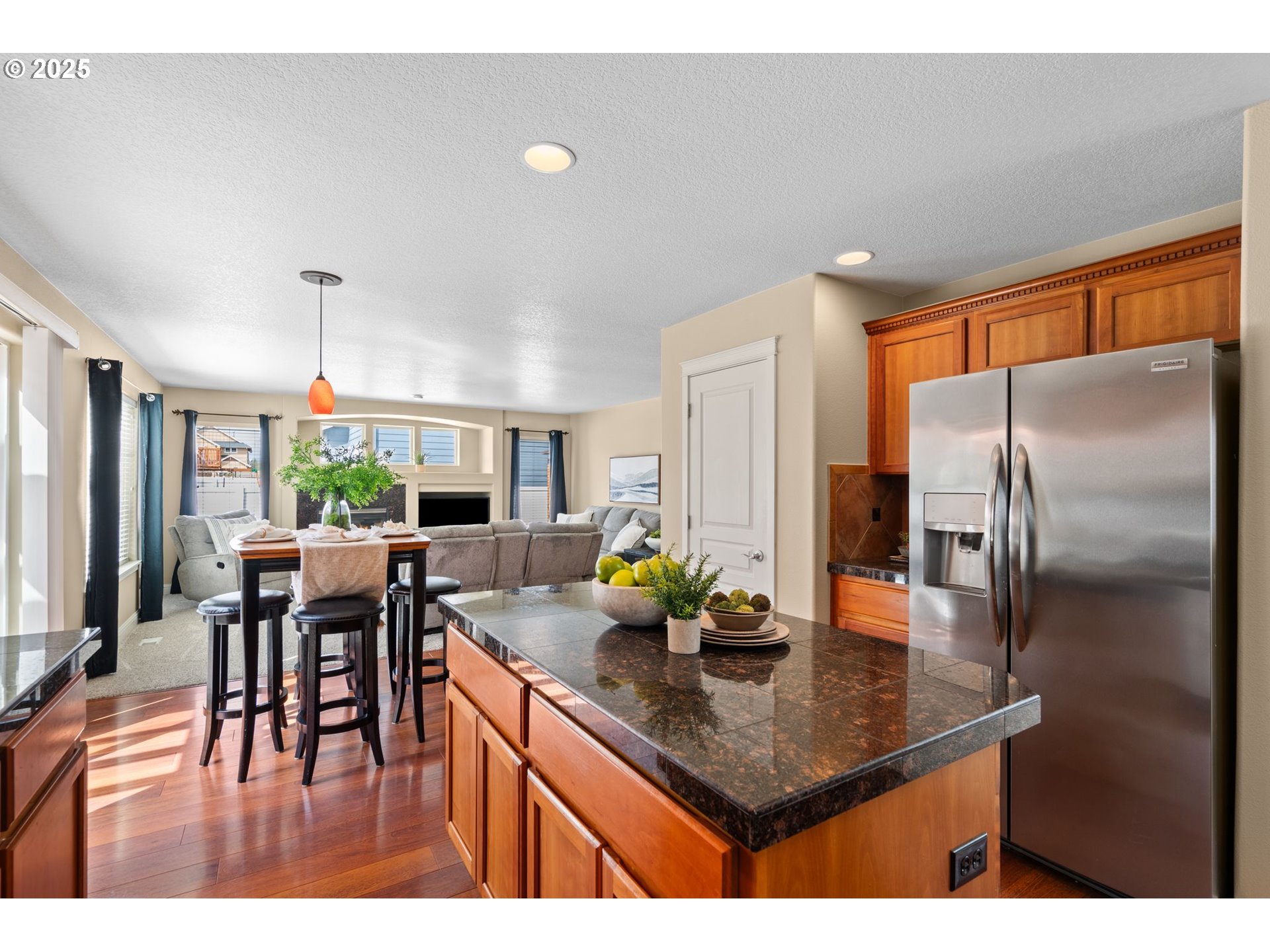 2597 North Lambert Street Cornelius, OR 97113 - Photo 13 of 48 a kitchen with a table chairs and refrigerator