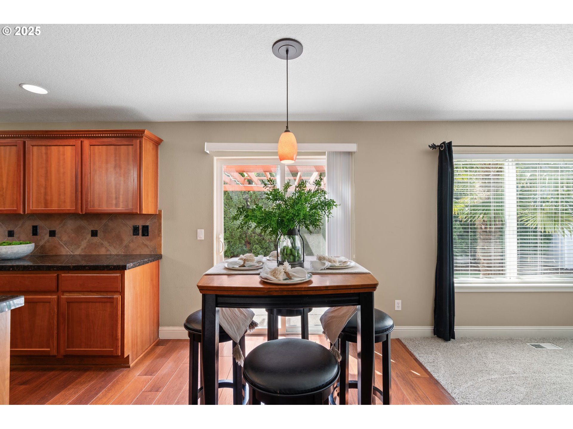 2597 North Lambert Street Cornelius, OR 97113 - Photo 17 of 48 a kitchen with a table and chairs in it