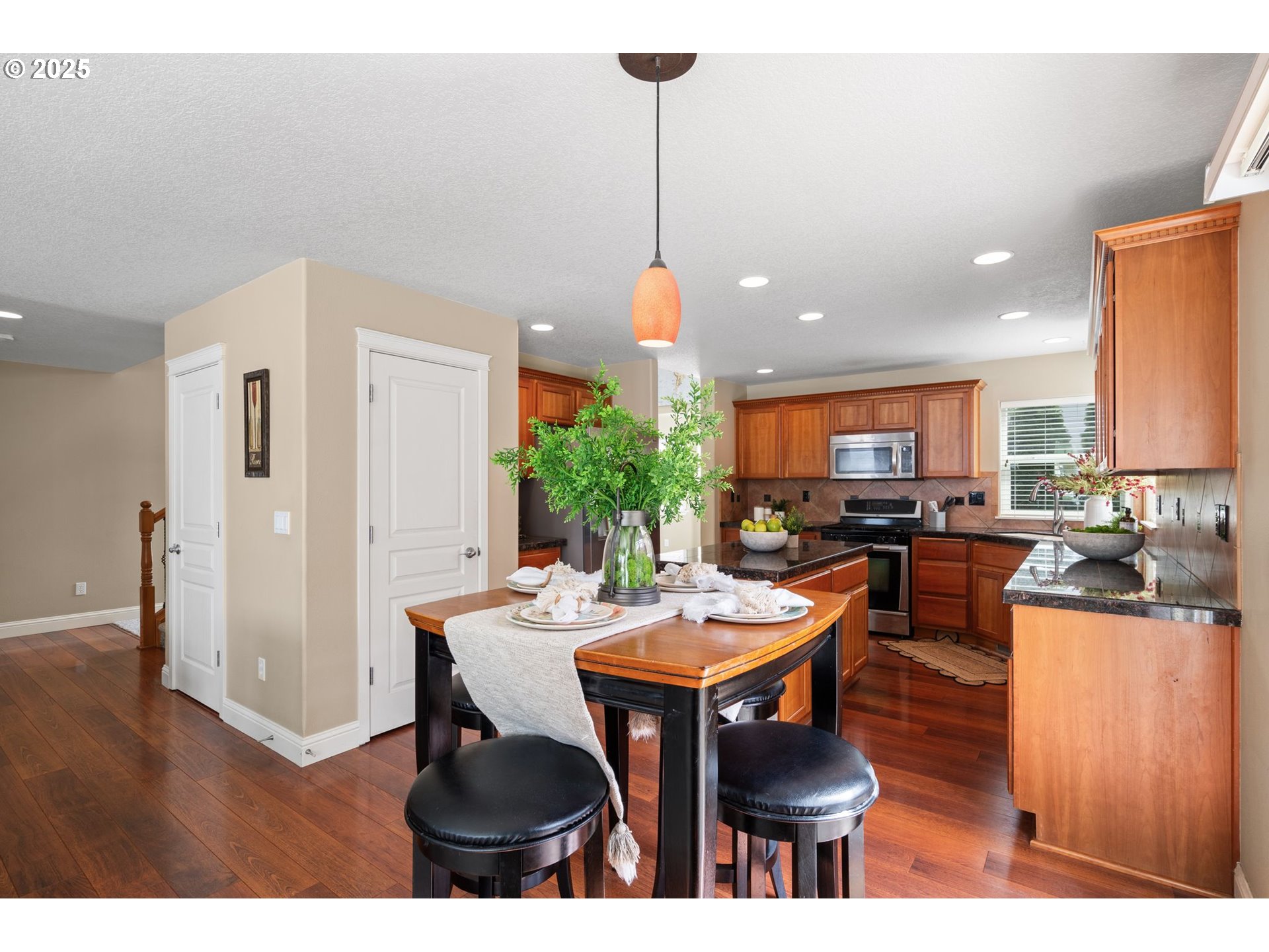 2597 North Lambert Street Cornelius, OR 97113 - Photo 19 of 48 a dining room with furniture a window and kitchen view
