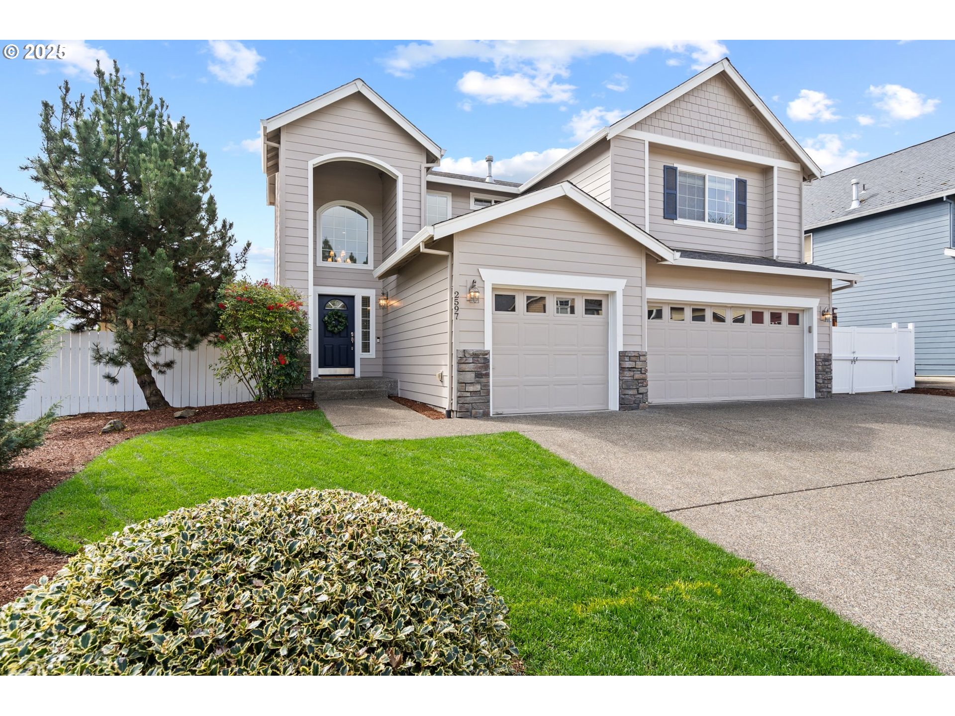 2597 North Lambert Street Cornelius, OR 97113 - Photo 2 of 48 a view of a house with a yard