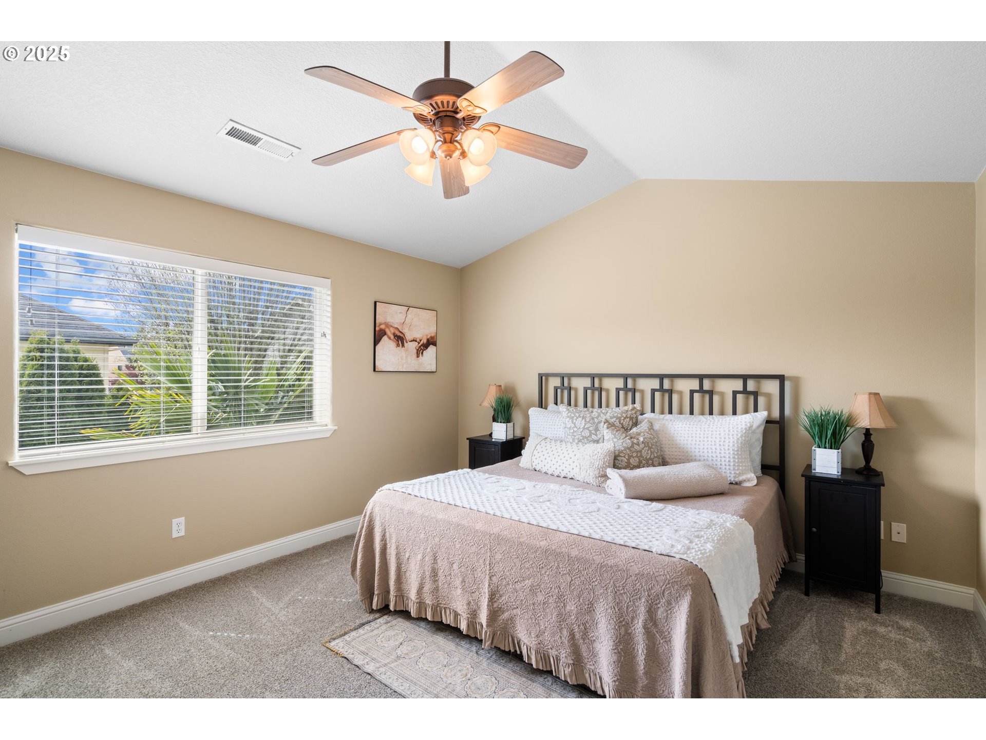 2597 North Lambert Street Cornelius, OR 97113 - Photo 30 of 48 a bedroom with a large bed and a chandelier