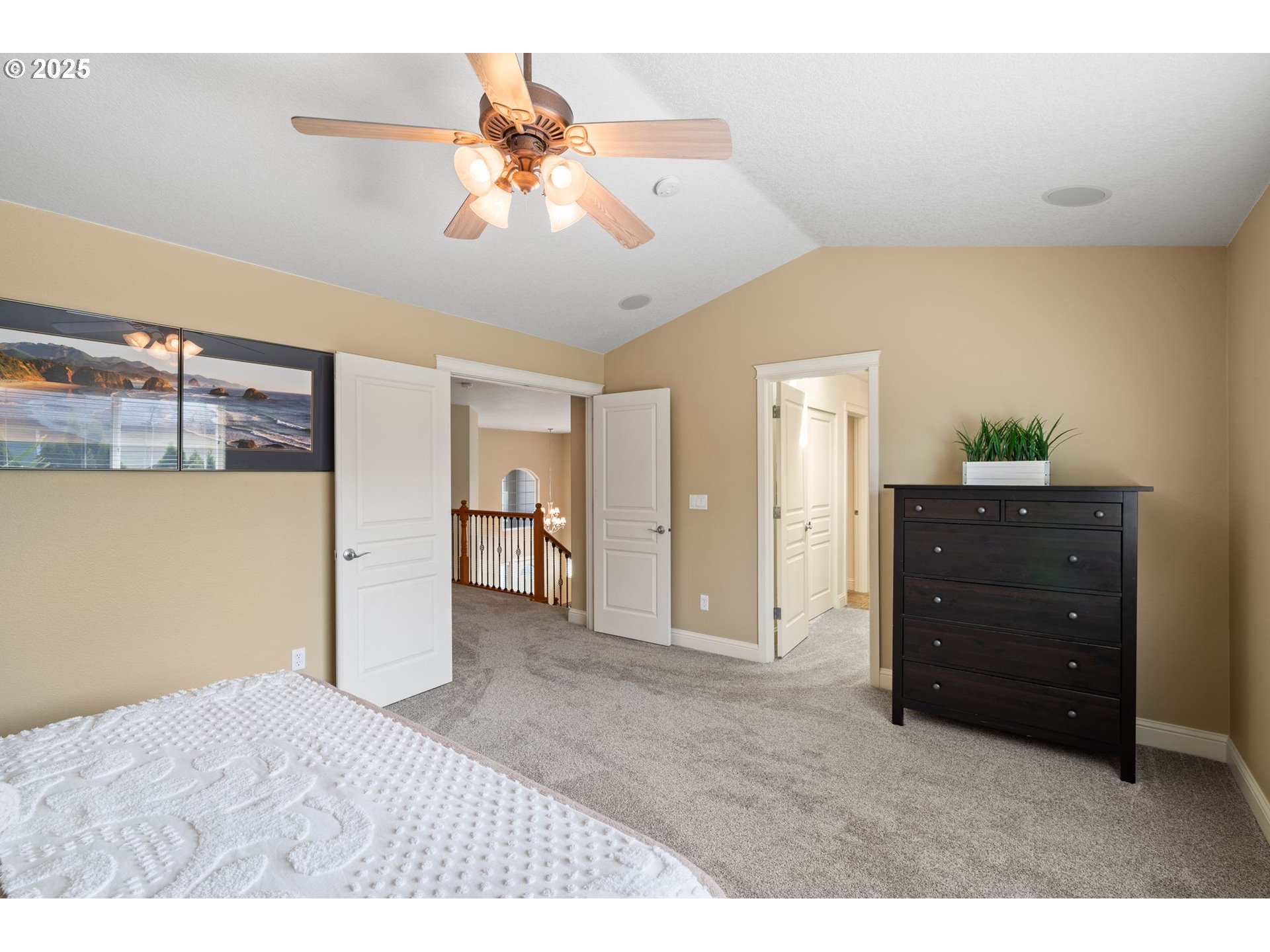 2597 North Lambert Street Cornelius, OR 97113 - Photo 32 of 48 a bedroom with a bed and a chandelier