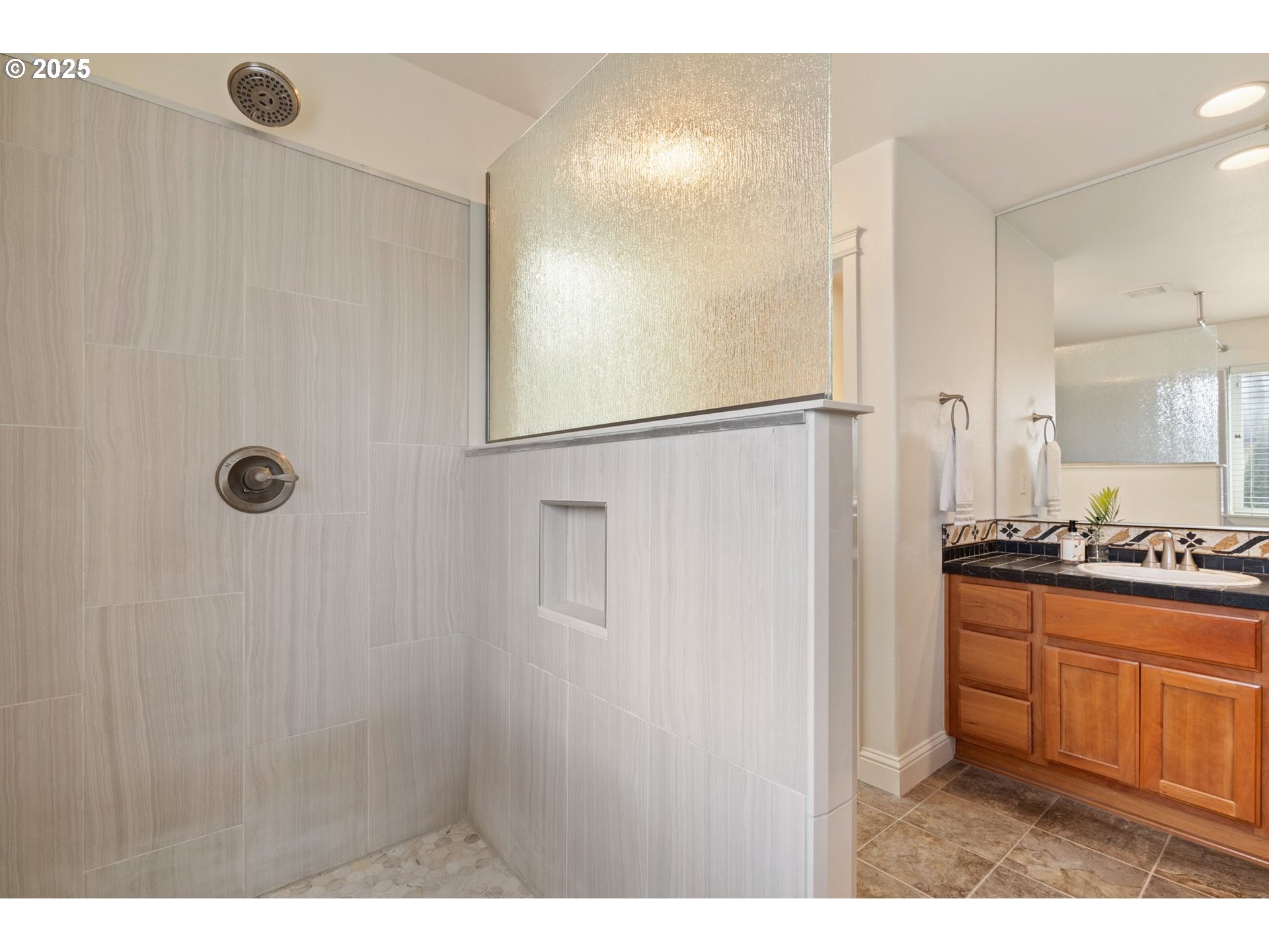 2597 North Lambert Street Cornelius, OR 97113 - Photo 36 of 48 a kitchen with kitchen island white cabinets and refrigerator