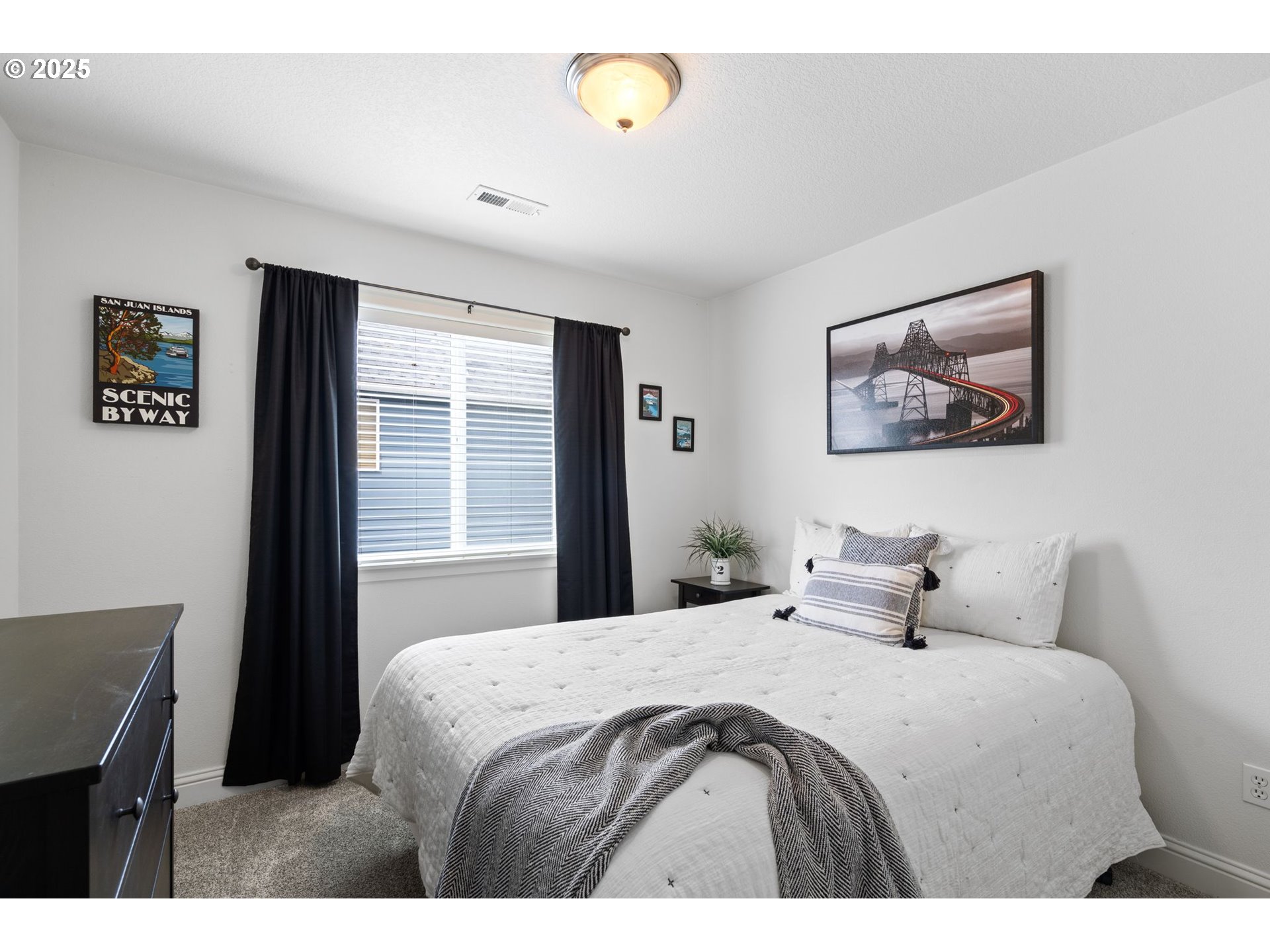 2597 North Lambert Street Cornelius, OR 97113 - Photo 38 of 48 a bedroom with a bed a painting on the wall and a window