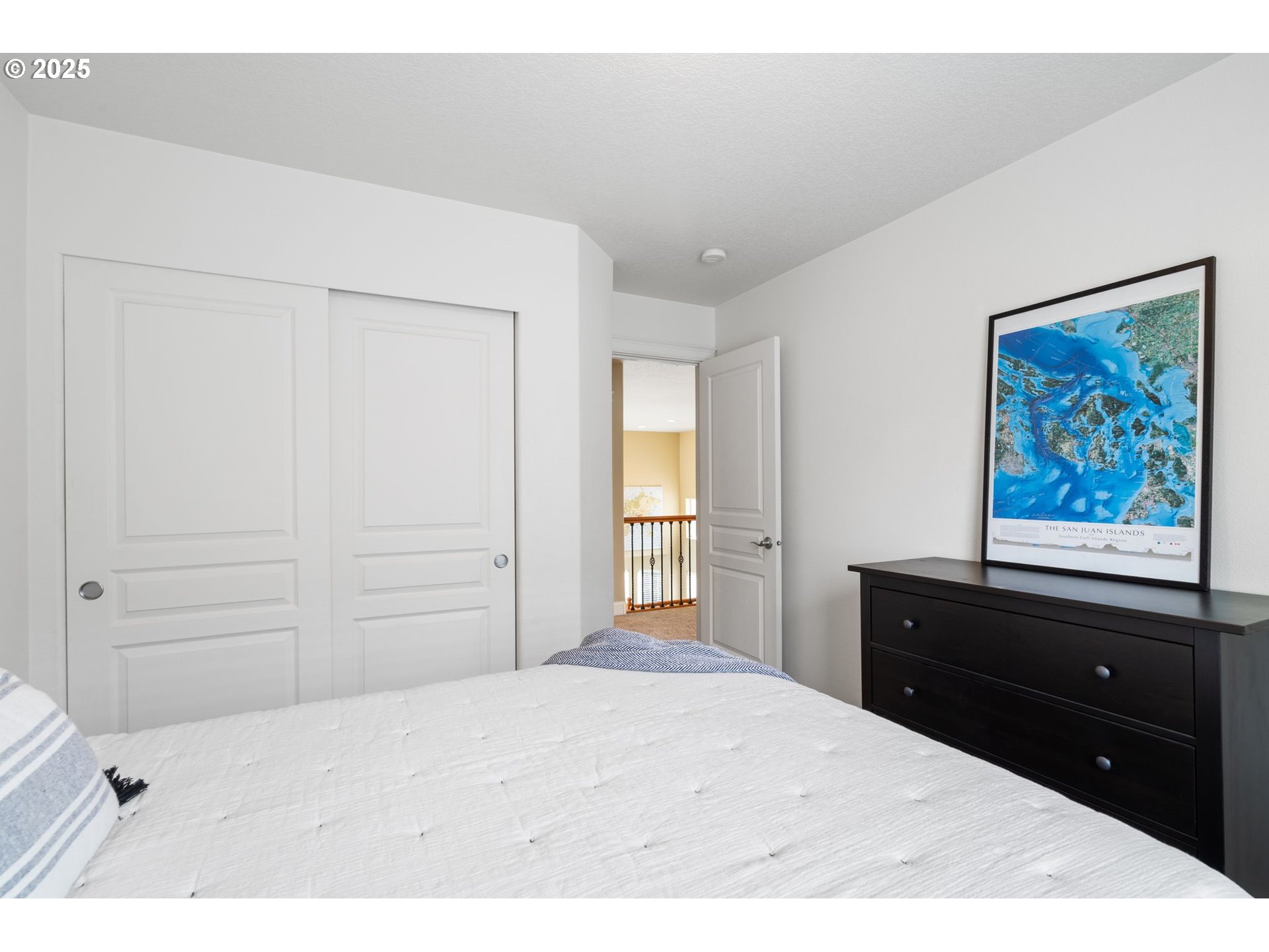 2597 North Lambert Street Cornelius, OR 97113 - Photo 39 of 48 a bedroom with a bed and a cabinet