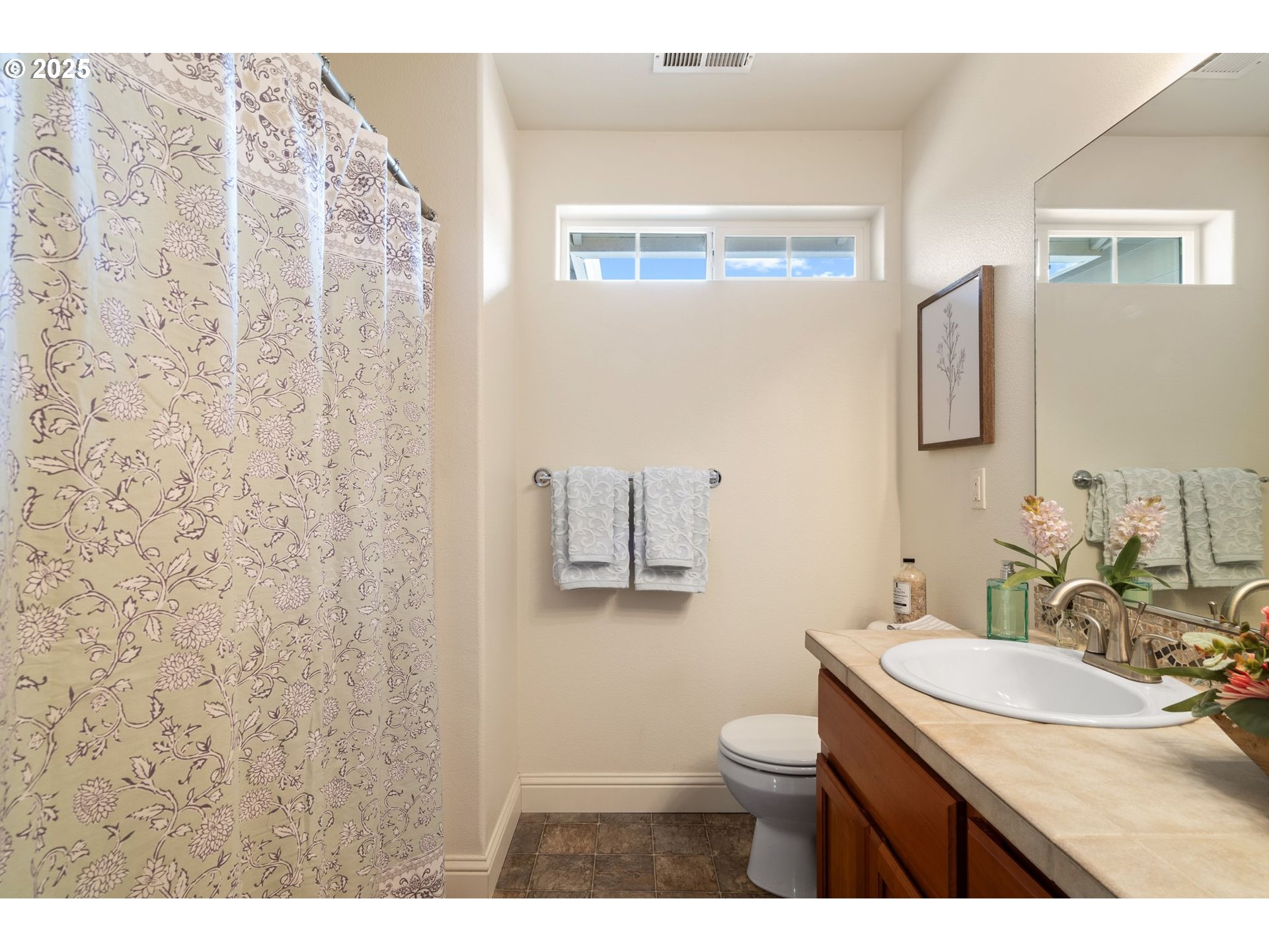 2597 North Lambert Street Cornelius, OR 97113 - Photo 43 of 48 a bathroom with a granite countertop sink a toilet and a mirror