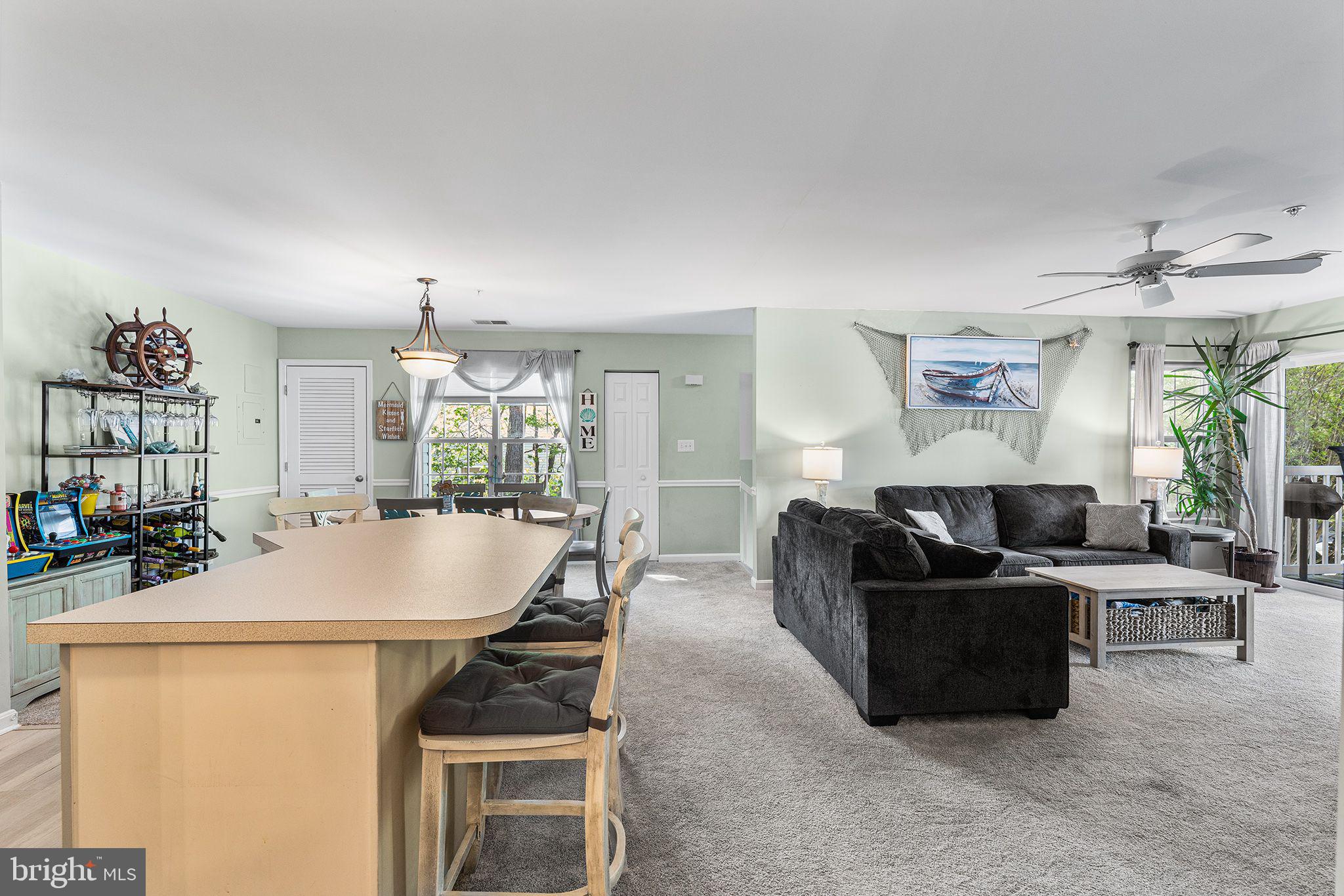 11431 Manklin Creek Road, Unit 5 Berlin, MD 21811 - Photo 12 of 38 a living room with furniture and a table