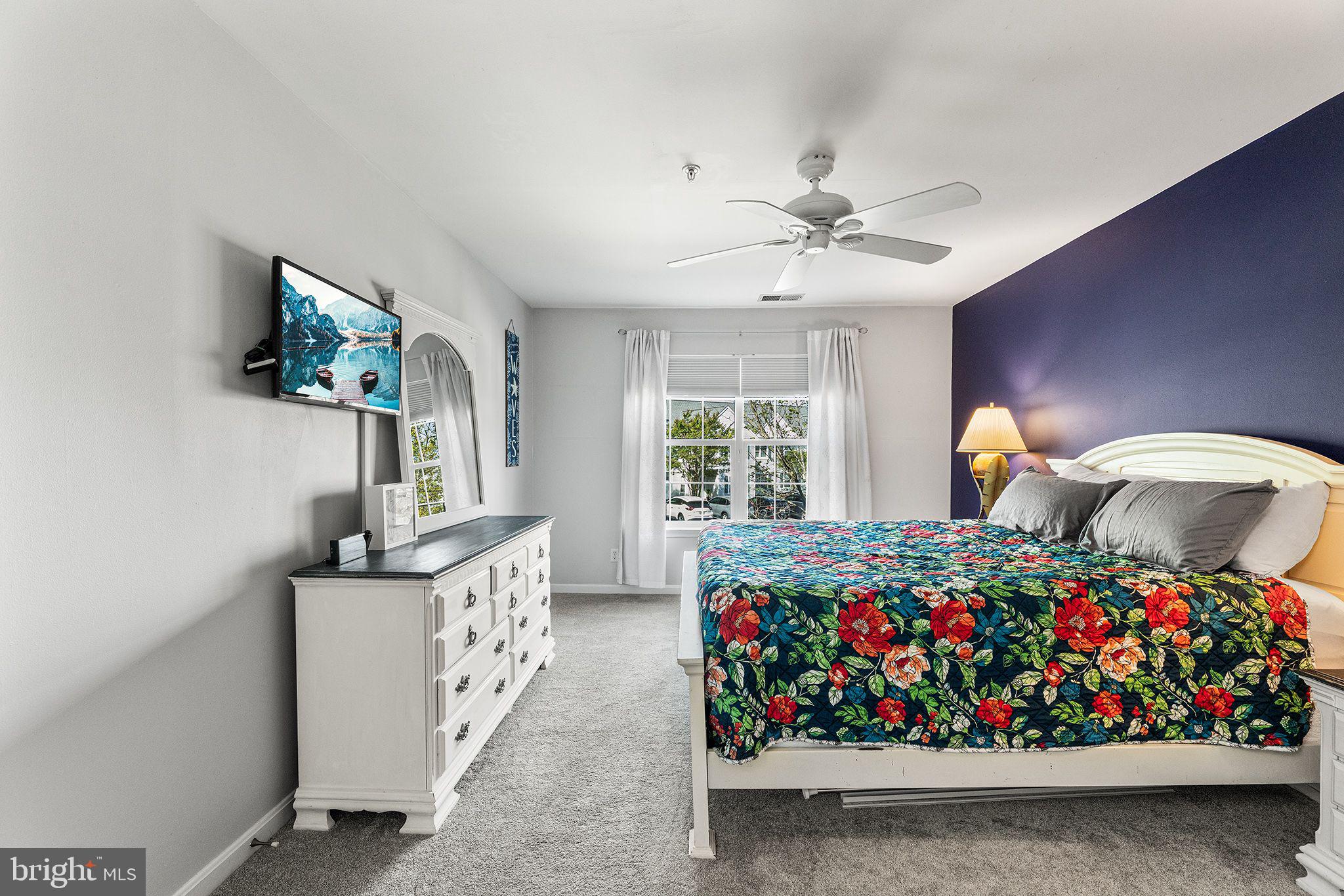 11431 Manklin Creek Road, Unit 5 Berlin, MD 21811 - Photo 16 of 38 a bedroom with bed and window