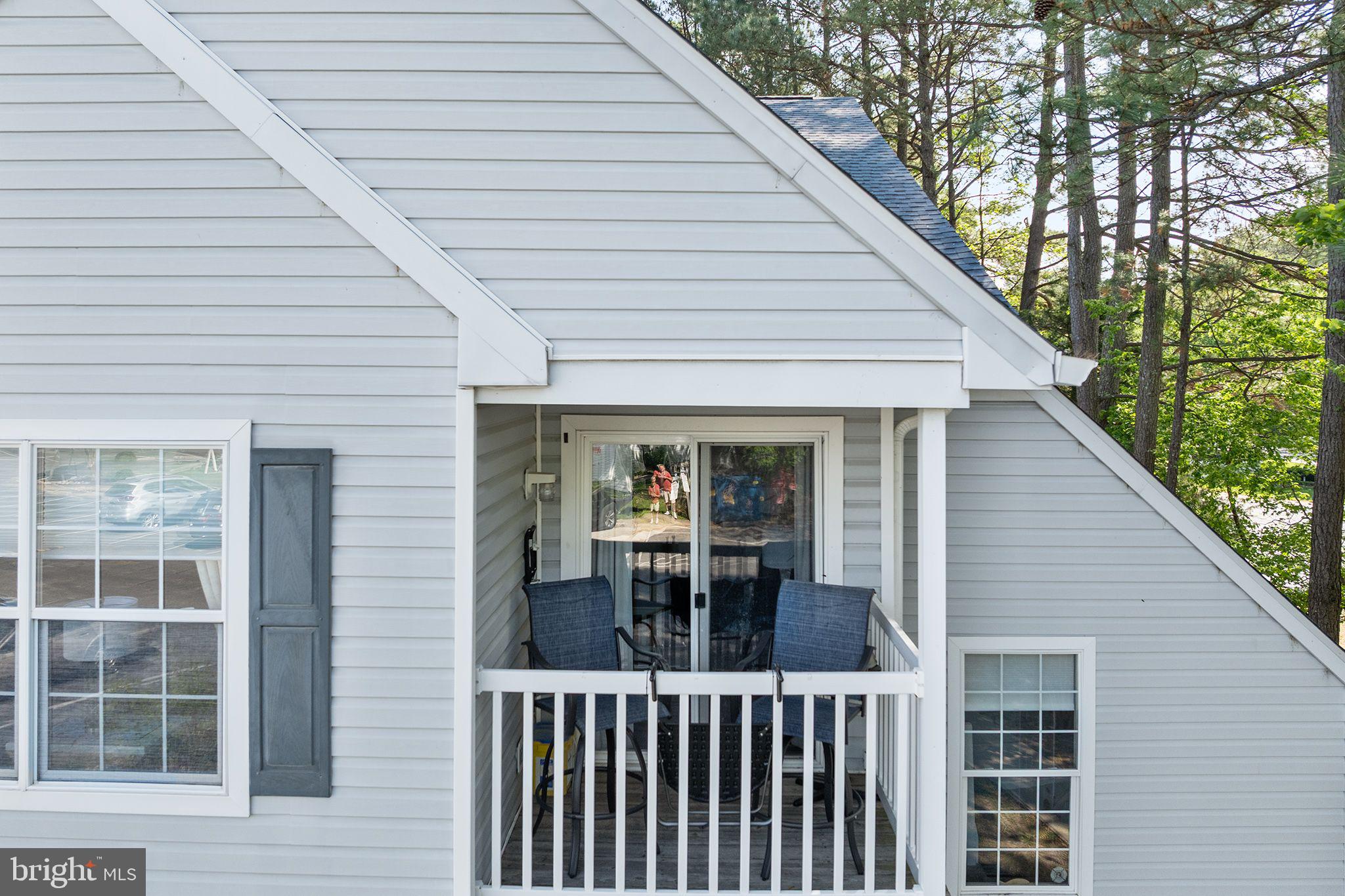11431 Manklin Creek Road, Unit 5 Berlin, MD 21811 - Photo 20 of 38 a view of a house with a porch