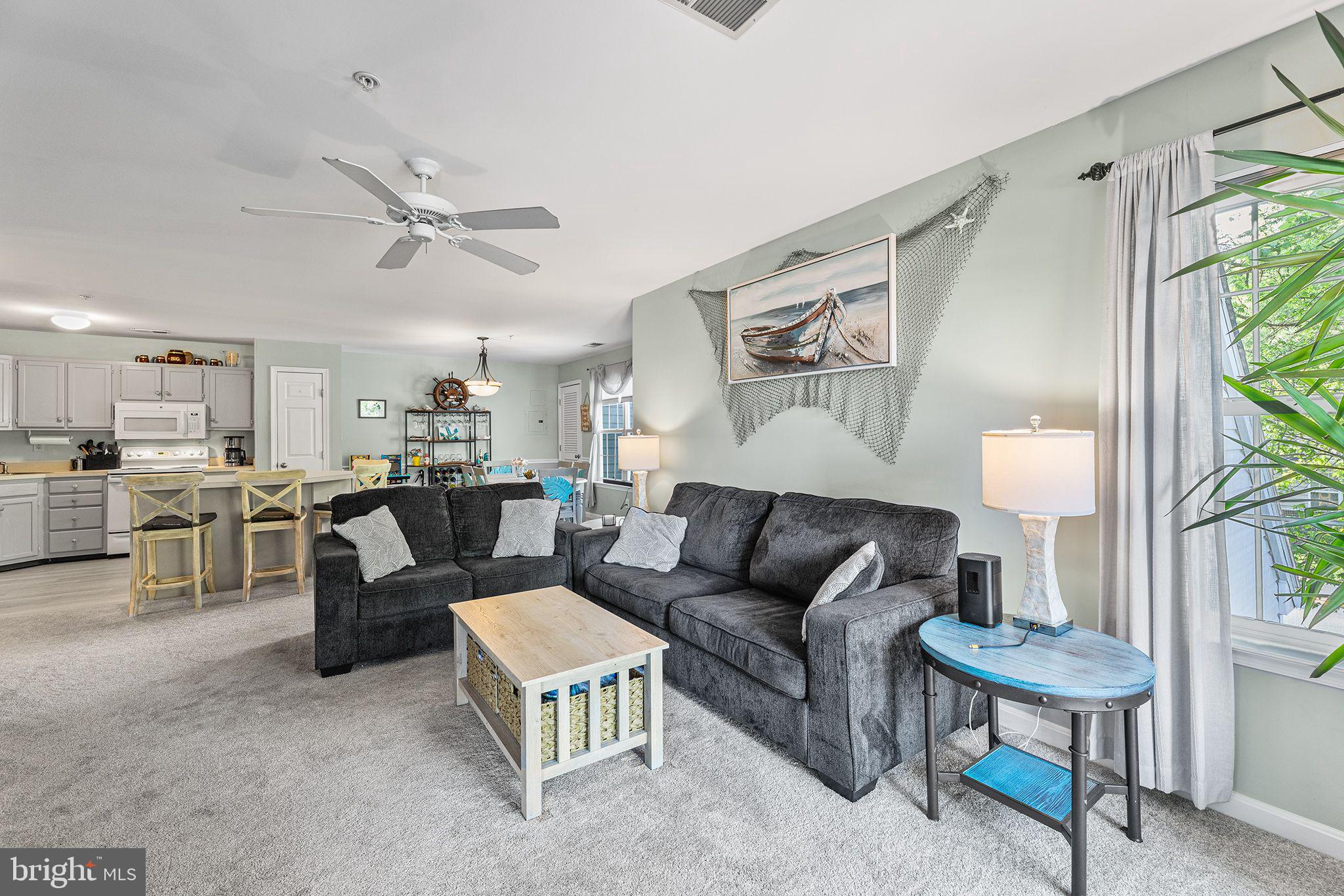 11431 Manklin Creek Road, Unit 5 Berlin, MD 21811 - Photo 2 of 38 a living room with furniture and a table