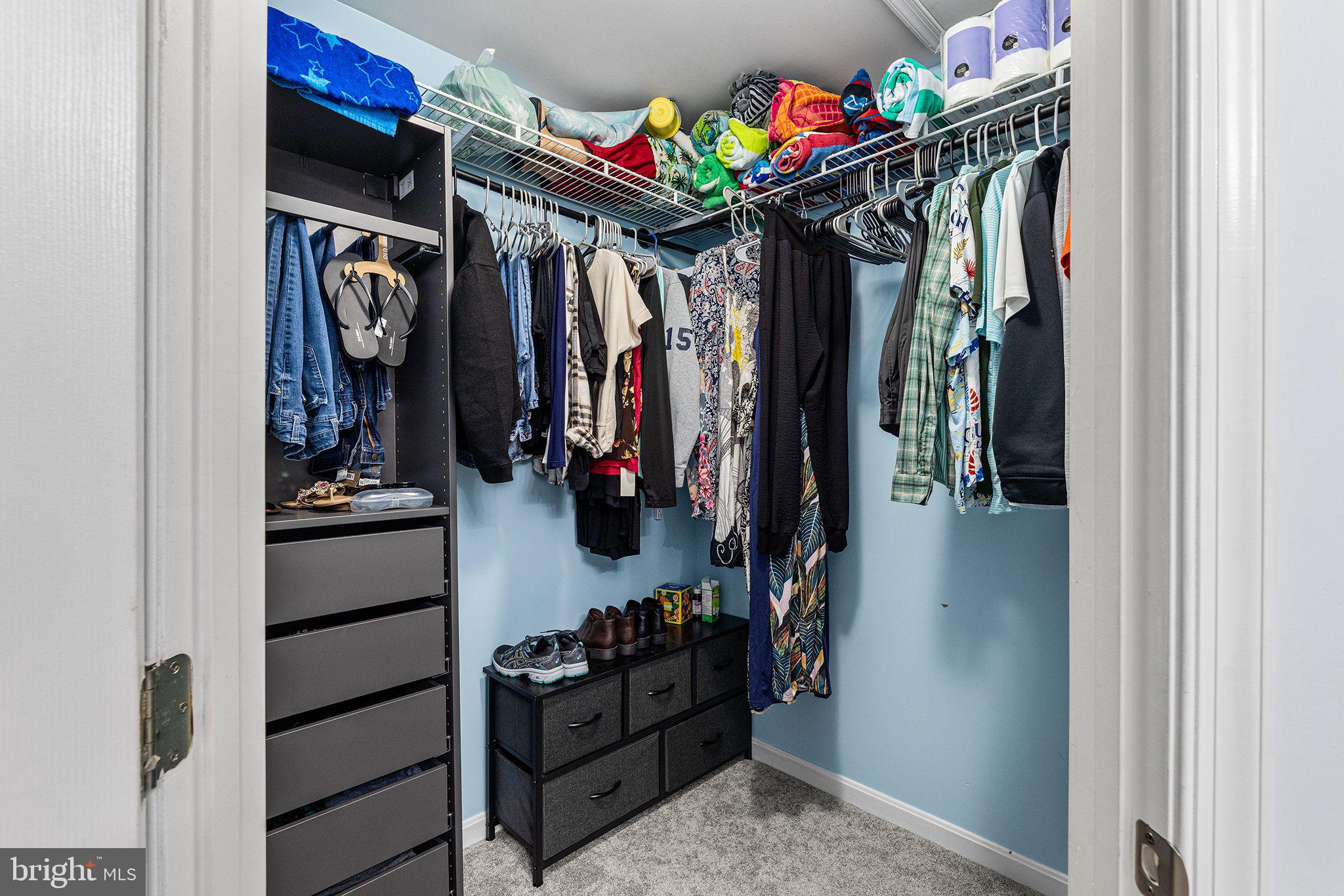 11431 Manklin Creek Road, Unit 5 Berlin, MD 21811 - Photo 26 of 38 a view of walk in closet with clothes and shoes
