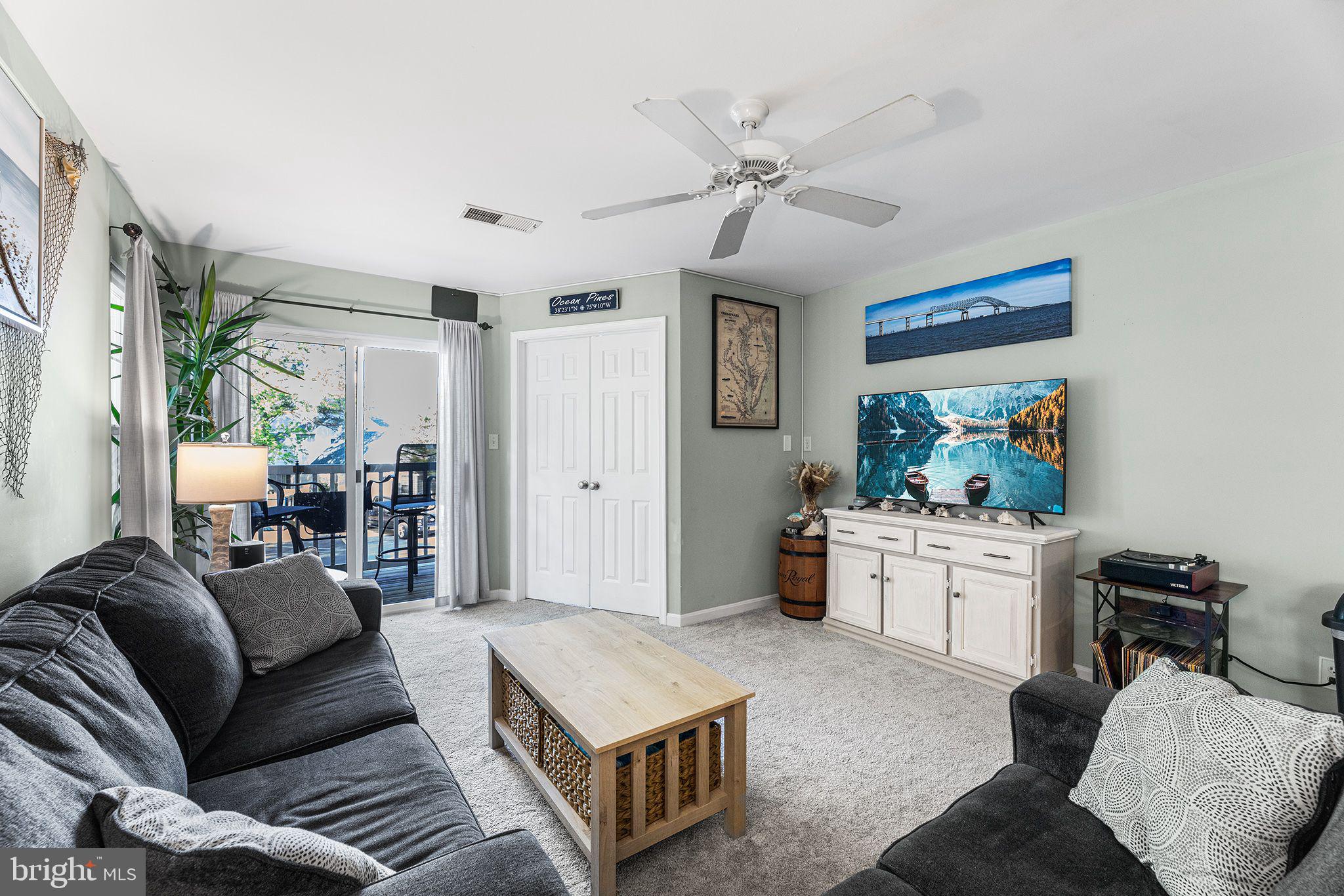 11431 Manklin Creek Road, Unit 5 Berlin, MD 21811 - Photo 3 of 38 a living room with furniture and a window