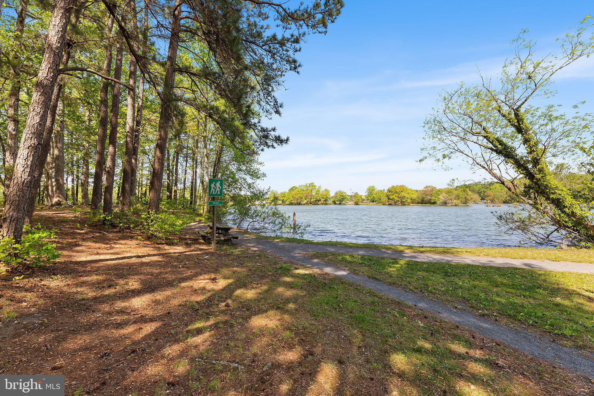 11431 Manklin Creek Road, Unit 5 Berlin, MD 21811 - Photo 35 of 38 a view of a yard with plants and trees