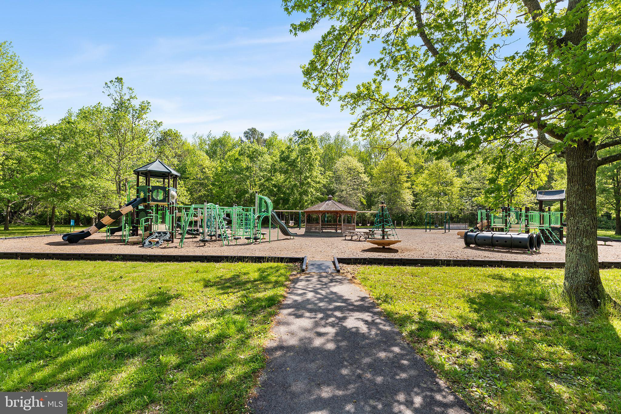 11431 Manklin Creek Road, Unit 5 Berlin, MD 21811 - Photo 37 of 38 a view of a swimming pool and lounge chairs