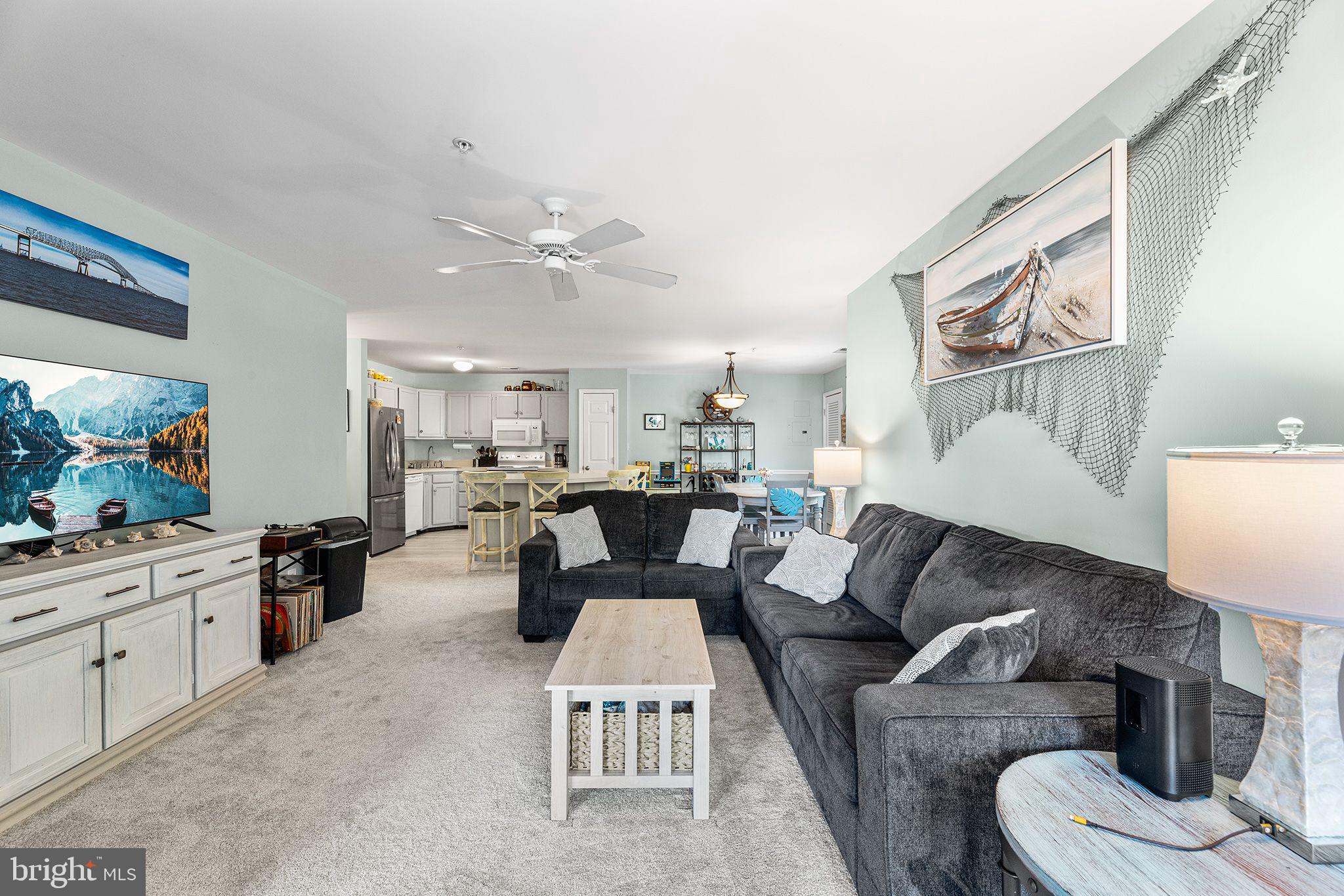 11431 Manklin Creek Road, Unit 5 Berlin, MD 21811 - Photo 4 of 38 a living room with furniture and a kitchen