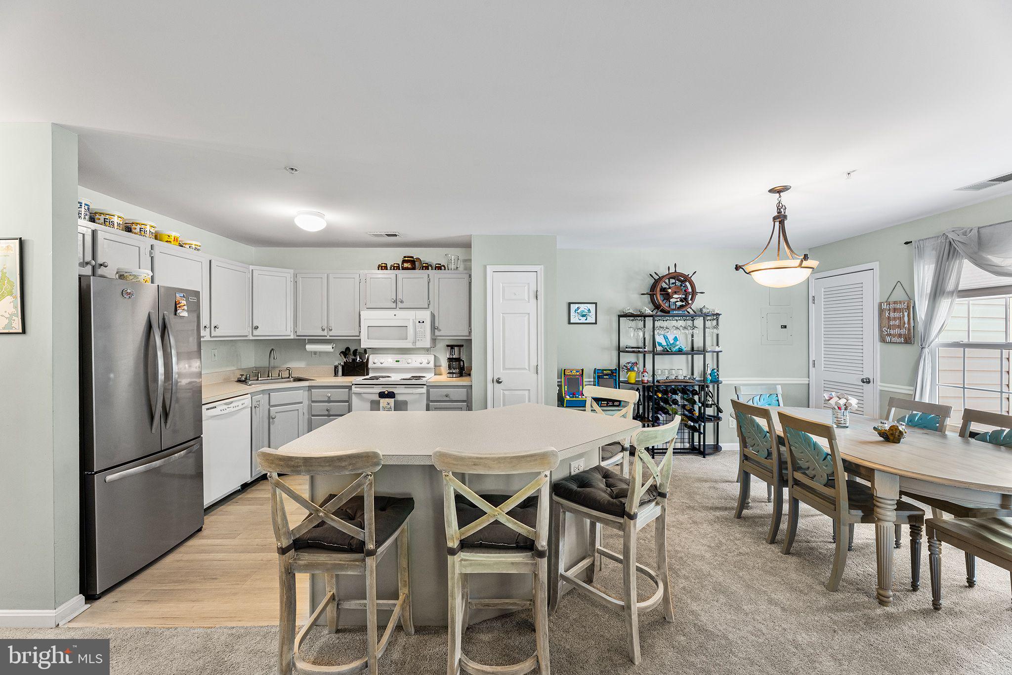 11431 Manklin Creek Road, Unit 5 Berlin, MD 21811 - Photo 6 of 38 a view of a dining room kitchen and a window