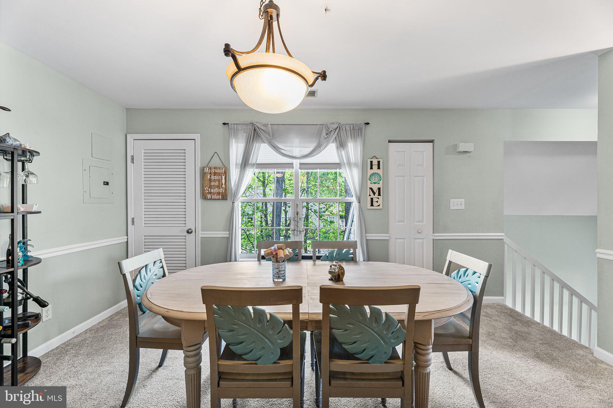 11431 Manklin Creek Road, Unit 5 Berlin, MD 21811 - Photo 10 of 38 a view of a dining room with furniture window and wooden floor