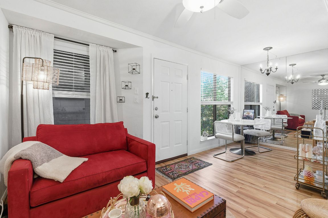 601 Hearn Street, Unit 204 Austin, TX 78703 - Photo 1 of 1 a living room with furniture and wooden floor