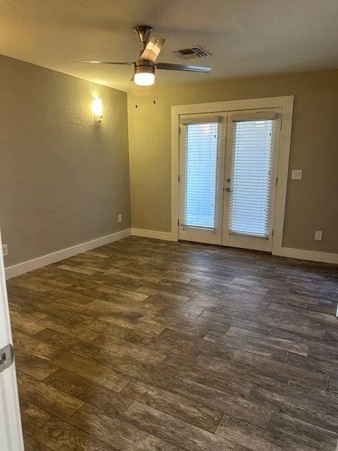 1416 East Del Rio Drive Tempe, AZ 85282 - Photo 26 of 27 a view of an empty room with window and chandelier fan