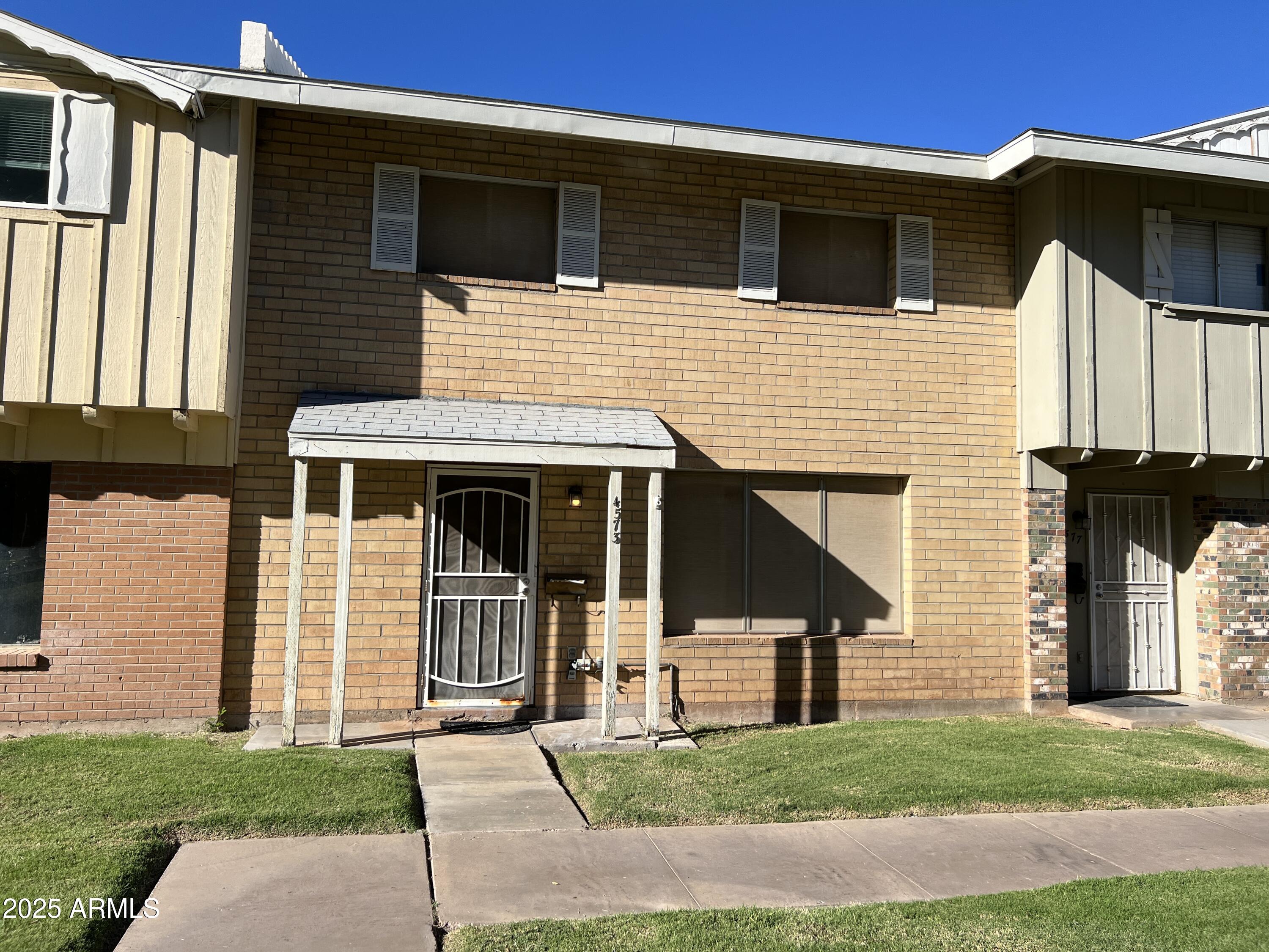 4573 South Mill Avenue Tempe, AZ 85282 - Photo 1 of 32 a front view of a house with a yard