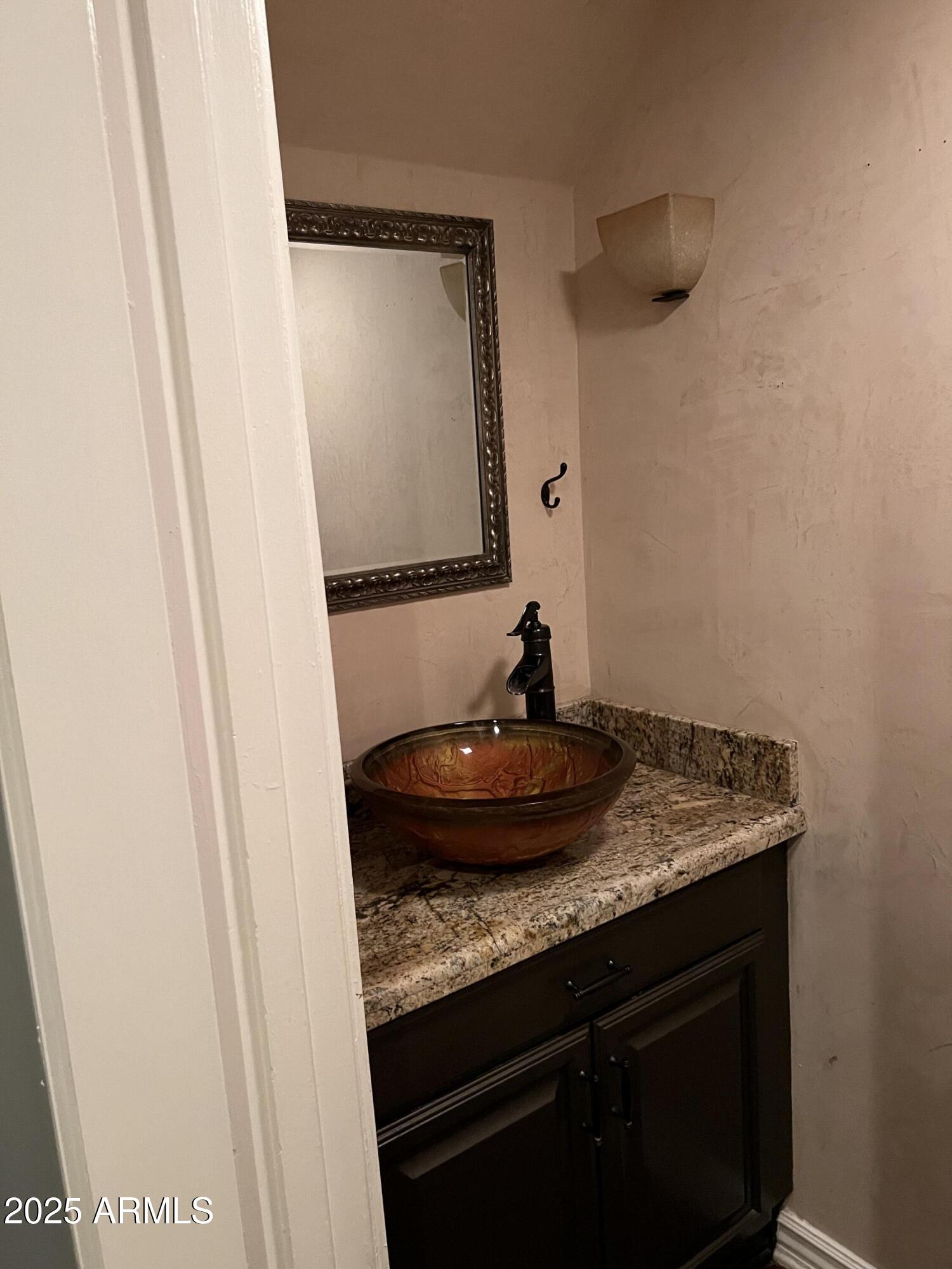 4573 South Mill Avenue Tempe, AZ 85282 - Photo 13 of 32 a bathroom with a granite countertop sink and a mirror