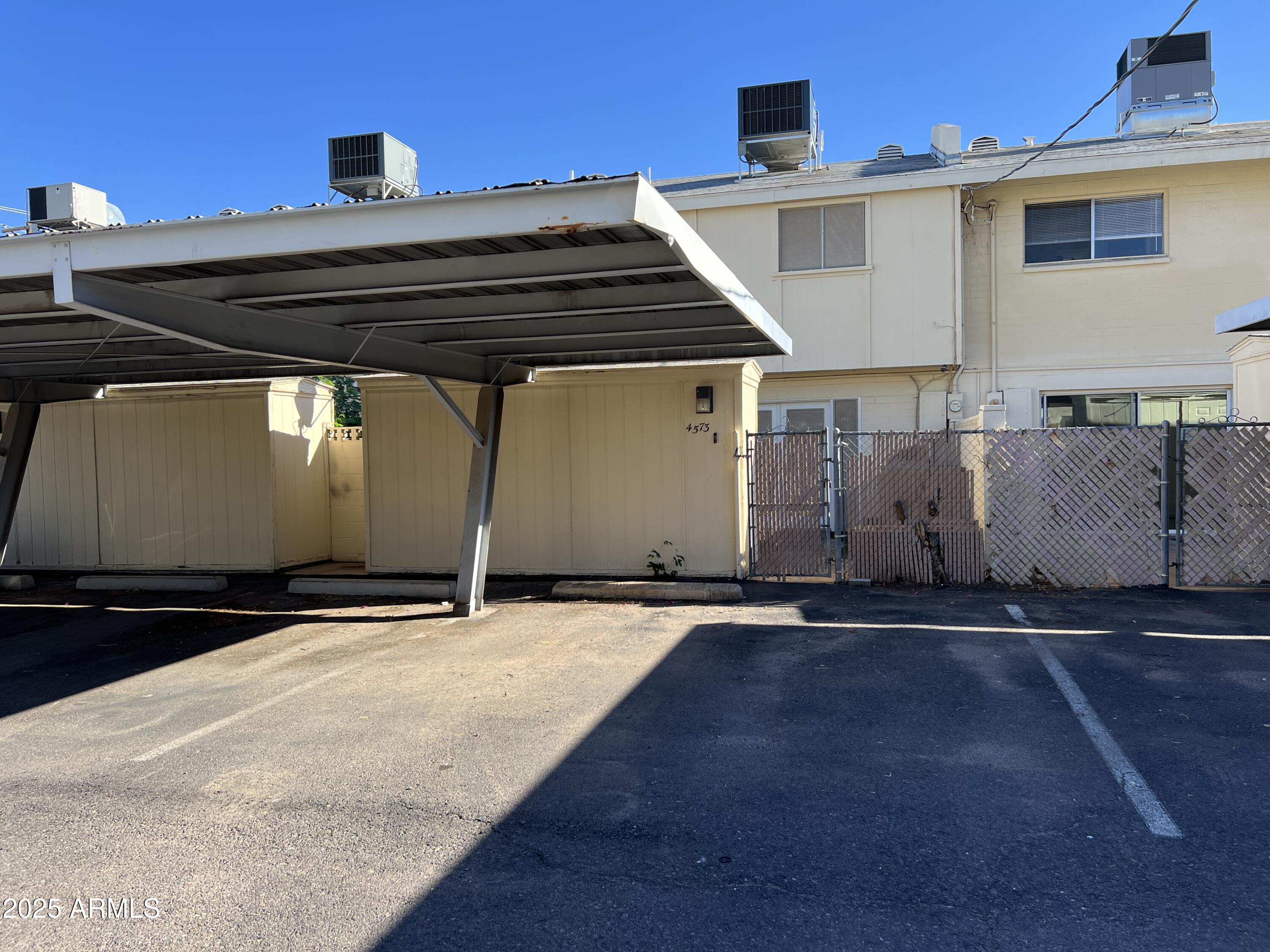 4573 South Mill Avenue Tempe, AZ 85282 - Photo 32 of 32 a backyard of a house with lots of trees and plants