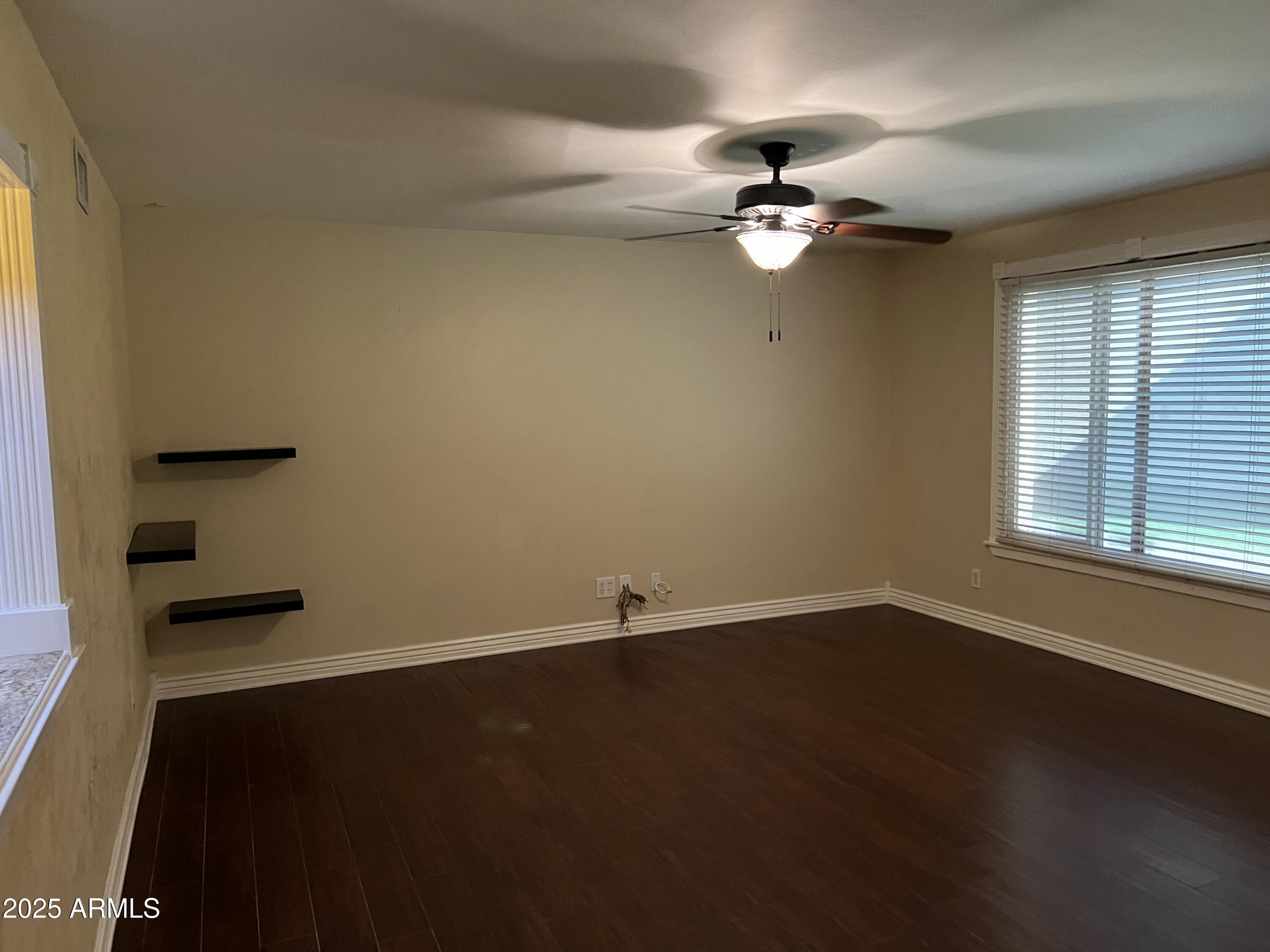4573 South Mill Avenue Tempe, AZ 85282 - Photo 4 of 32 a view of an empty room with a window