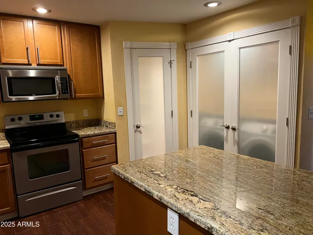 a kitchen with a stove and a microwave