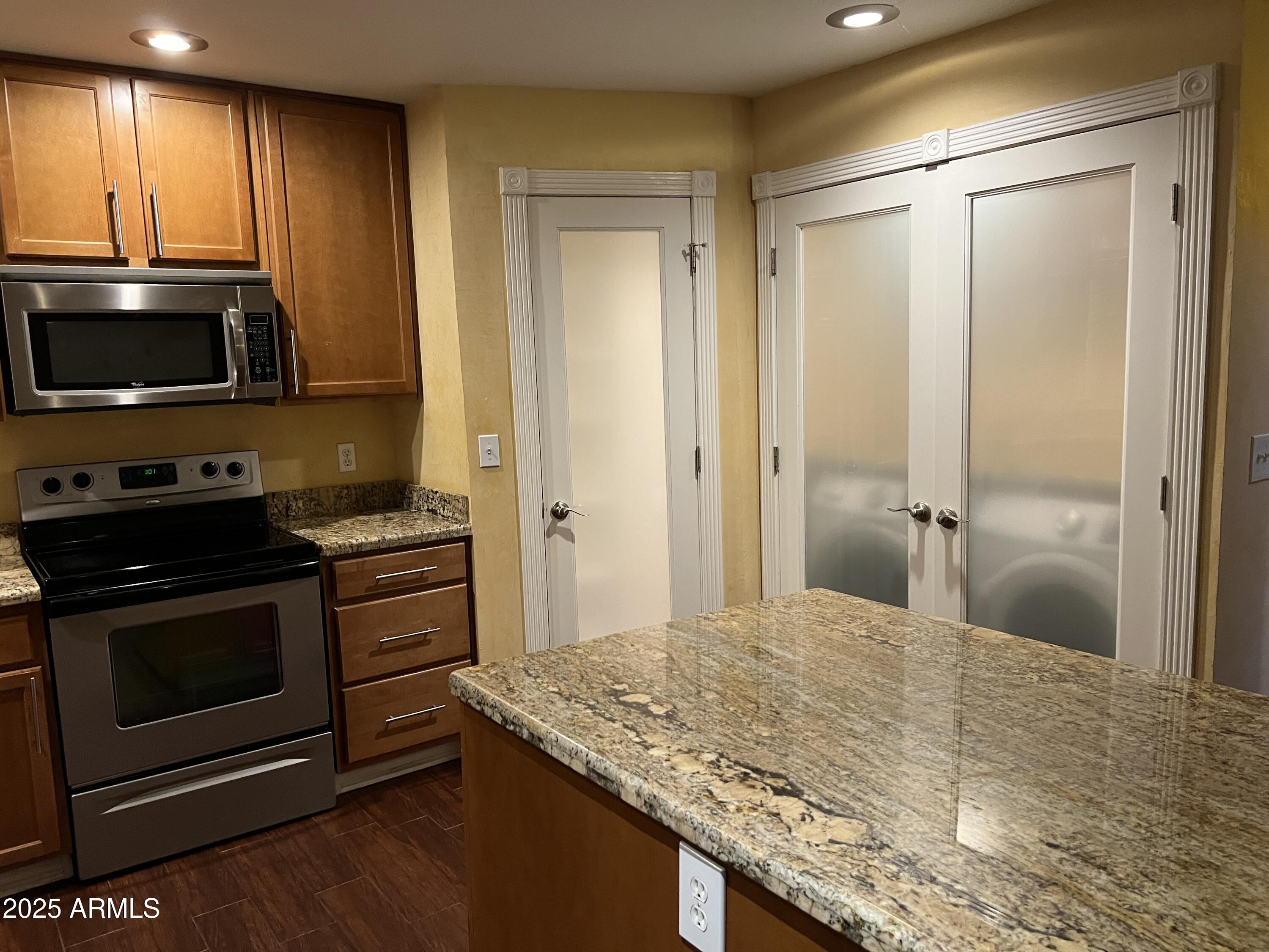4573 South Mill Avenue Tempe, AZ 85282 - Photo 8 of 32 a kitchen with a stove and a microwave
