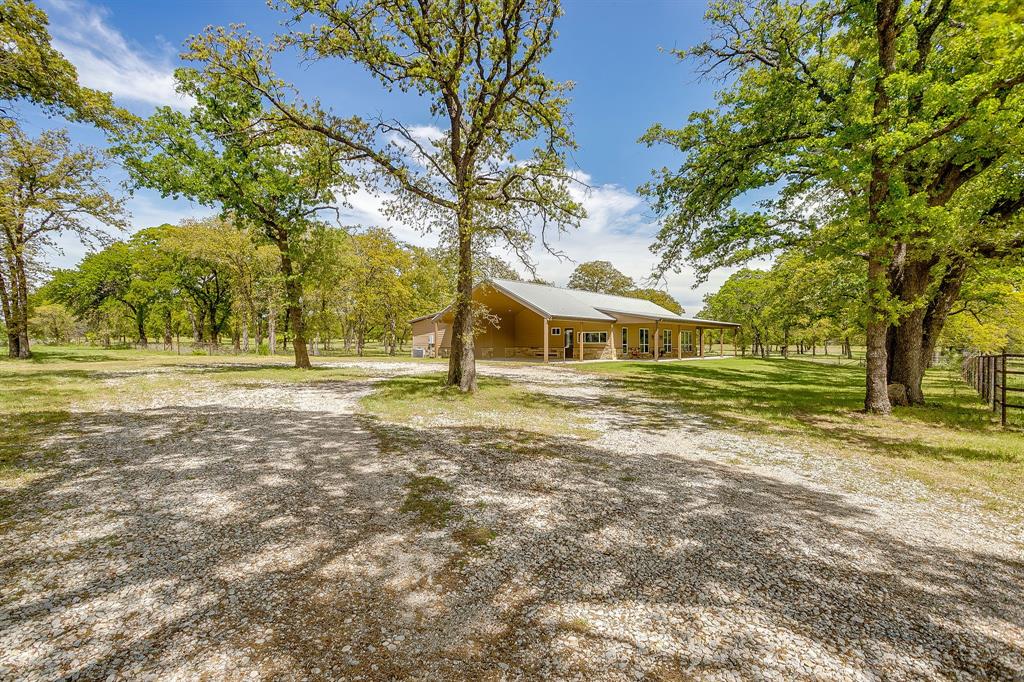 990 Doss Road Millsap, TX 76066 - Photo 12 of 39 a front view of a house with a yard