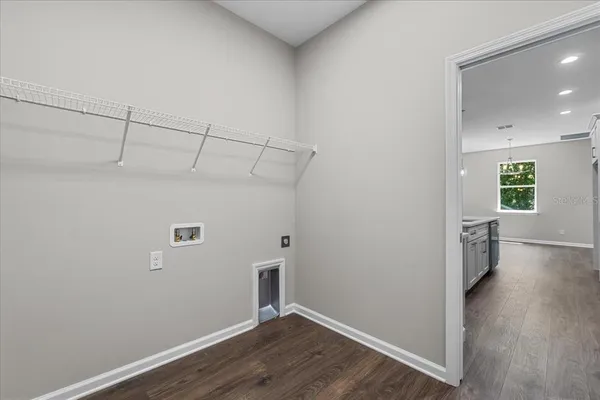 a view of a livingroom with a ceiling fan and window